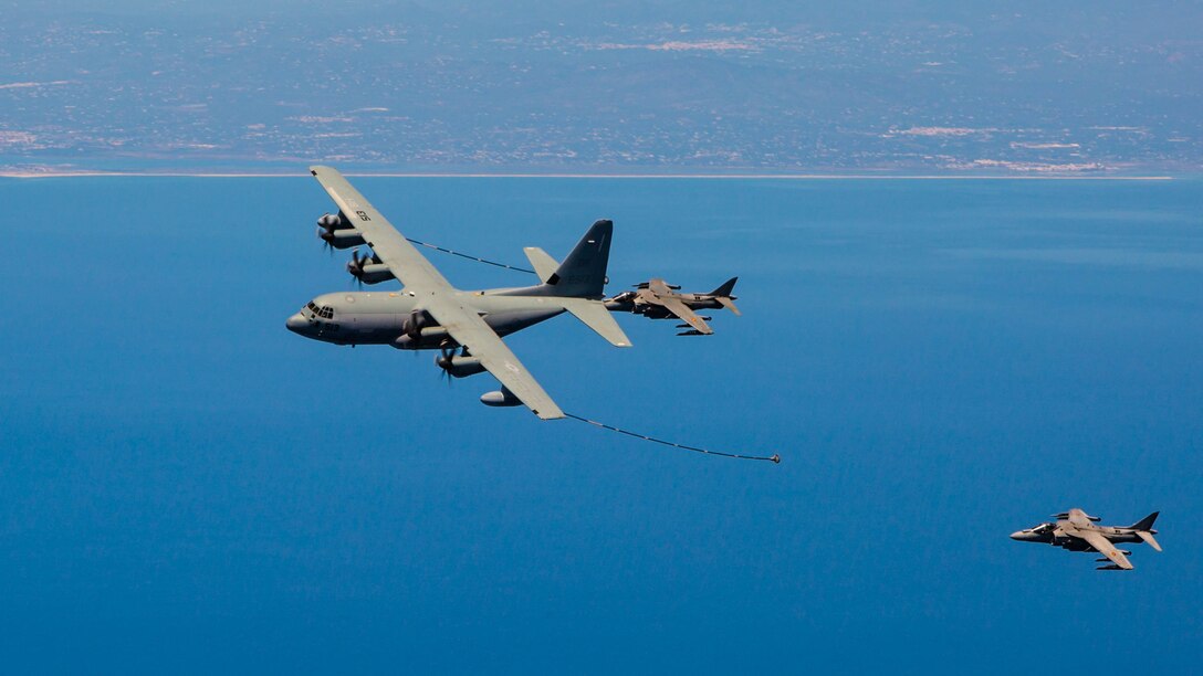 Two Spanish Navy Harriers fly behind a U.S. Marine KC-130J from Special-Purpose Marine Air-Ground Task Force Crisis Response-Africa during aerial-refueling training off the coast of Spain May 15, 2015. The aircraft linked up over the water and flew in formation to allow the Spanish pilots to test their ability to connect to the refueling lines on the KC-130J. 