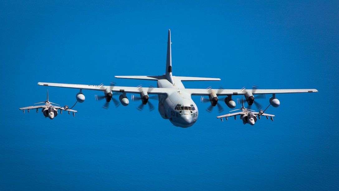 Two Spanish Navy Harriers fly behind a U.S. Marine KC-130J from Special-Purpose Marine Air-Ground Task Force Crisis Response-Africa during an aerial-refueling exercise off the coast of Spain May 15, 2015. The aerial-refueling capabilities of the KC-130J greatly extend the range and flight times of NATO aircraft. 