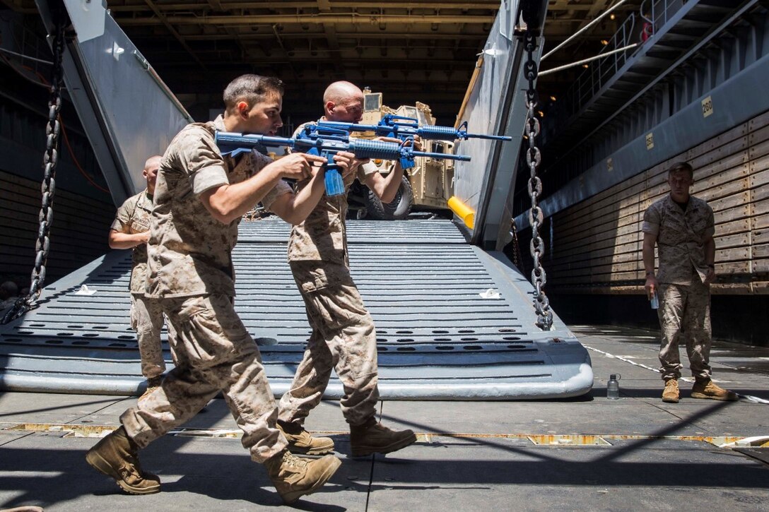 U.S. Marines with Kilo Company, Battalion Landing Team 3rd Battalion, 1st Marine Regiment, 15th Marine Expeditionary Unit, rehearse urban operations tactics aboard the USS Rushmore (LSD 47) at sea in the Pacific Ocean, May 15, 2015. While at sea the Marines continue training to maintain their proficiency at a wide variety of mission sets. (U.S. Marine Corps photo by Sgt. Emmanuel Ramos/Released)