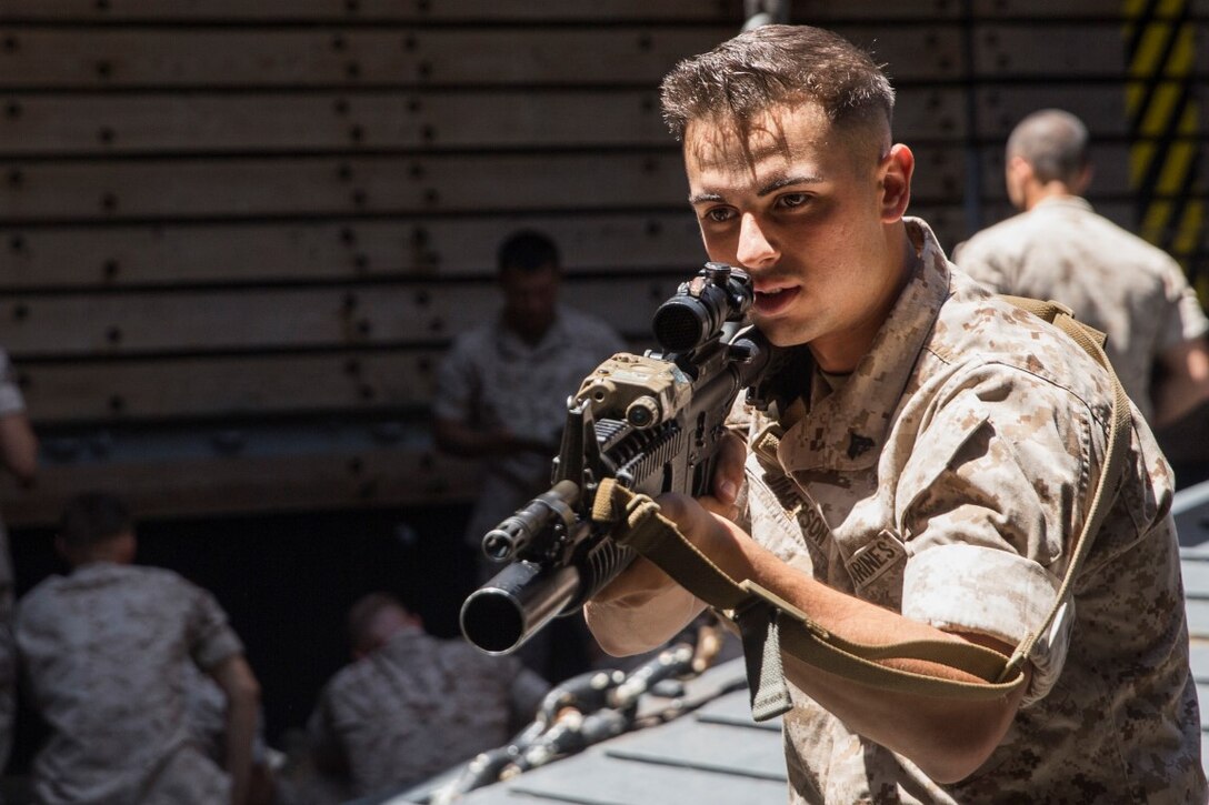 U.S. Marine Cpl. Christopher Jimerson rehearses urban operations tactics aboard the USS Rushmore (LSD 47) at sea in the Pacific Ocean, May 15, 2015. Jimmerson is an assault amphibious vehicle crew chief with Kilo Company, Battalion Landing Team 3rd Battalion, 1st Marine Regiment, 15th Marine Expeditionary Unit. While at sea the Marines continue training to maintain their proficiency at a wide variety of mission sets. (U.S. Marine Corps photo by Sgt. Emmanuel Ramos/Released)