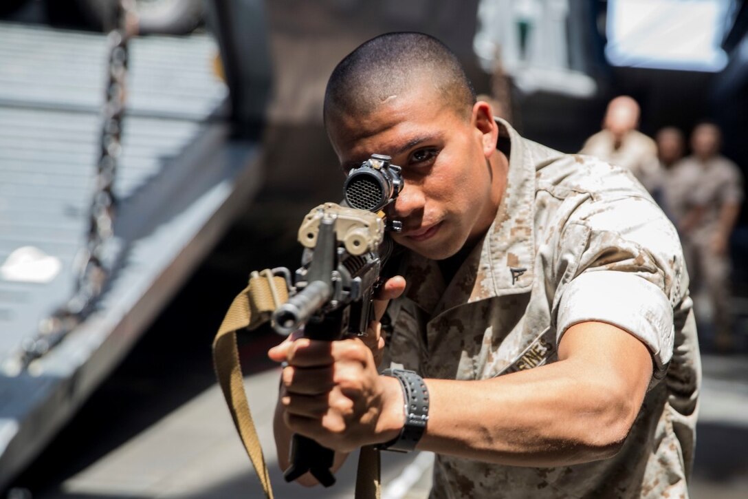 U.S. Marine Cpl. Jesus Orozco rehearses urban operations tactics aboard the USS Rushmore (LSD 47) at sea in the Pacific Ocean, May 15, 2015. Orozco is an assault amphibious vehicle crewman with Kilo Company, Battalion Landing Team 3rd Battalion, 1st Marine Regiment, 15th Marine Expeditionary Unit. While at sea the Marines continue training to maintain their proficiency at a wide variety of mission sets. (U.S. Marine Corps photo by Sgt. Emmanuel Ramos/Released)