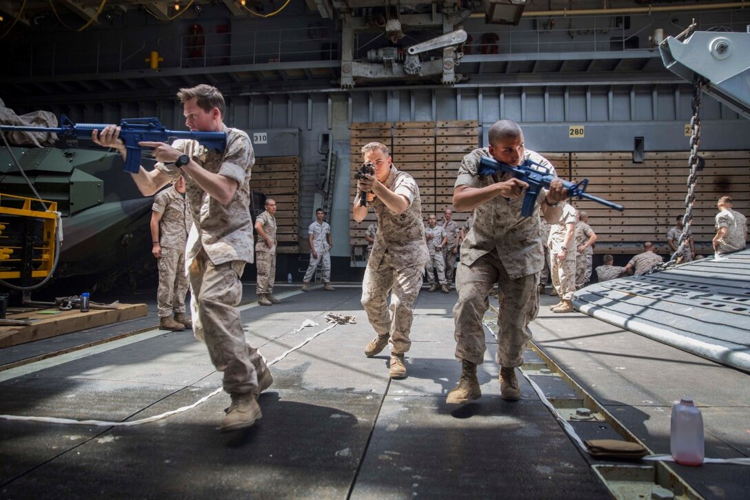 U.S. Marines with Kilo Company, Battalion Landing Team 3rd Battalion, 1st Marine Regiment, 15th Marine Expeditionary Unit, rehearse urban operations tactics aboard the USS Rushmore (LSD 47) at sea in the Pacific Ocean, May 15, 2015. While at sea the Marines continue training to maintain their proficiency at a wide variety of mission sets. (U.S. Marine Corps photo by Sgt. Emmanuel Ramos/Released)
