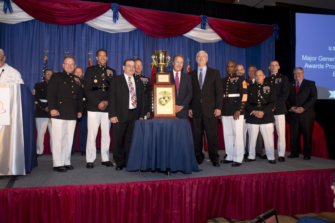 Lieutenant General William M. Faulkner, Deputy Commandant of I&L, Col David E. Jones, commanding officer of the Marine Corps Combat Service Support Schools, Camp Johnson, NC, Mr. Mike Picano, Sodexo General Manager, and members of Mess Hall 455, Camp Johnson, Marine Corps Base Camp Lejeune accept the trophy for "Best Foodservice Contracted Garrison Mess Hall" in the MajGen W.P.T. Hill Memorial Awards Category at the 2015 Armed Forces Foodservice Awards Dinner in Chicago, Ill., May 15, 2015.
(U.S. Marine Corps Combat Camera photo by GySgt Cruz G. Sotelo/Released)