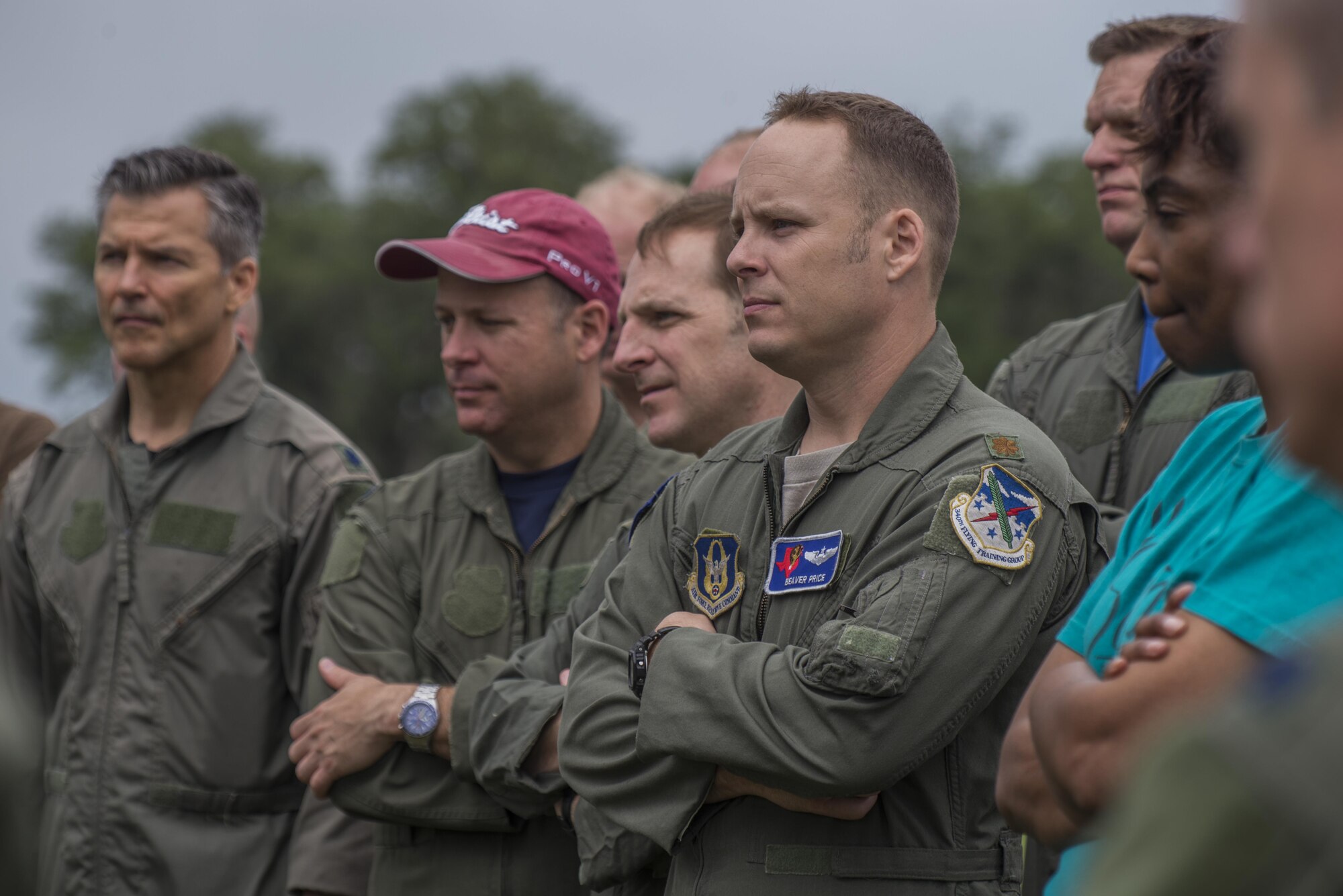 Members of the 39th Flying Training Squadron are briefed on proper water survival practices before a helicopter search and rescue training event May 7,2015, at Canyon Lake, Texas. The Training included being transported by boat and placed in open water and then being hoisted up to helicopter by a ‘strop’ harness or rescue basket. (U.S. Air Force photo by Airman 1st Class Stormy Archer)