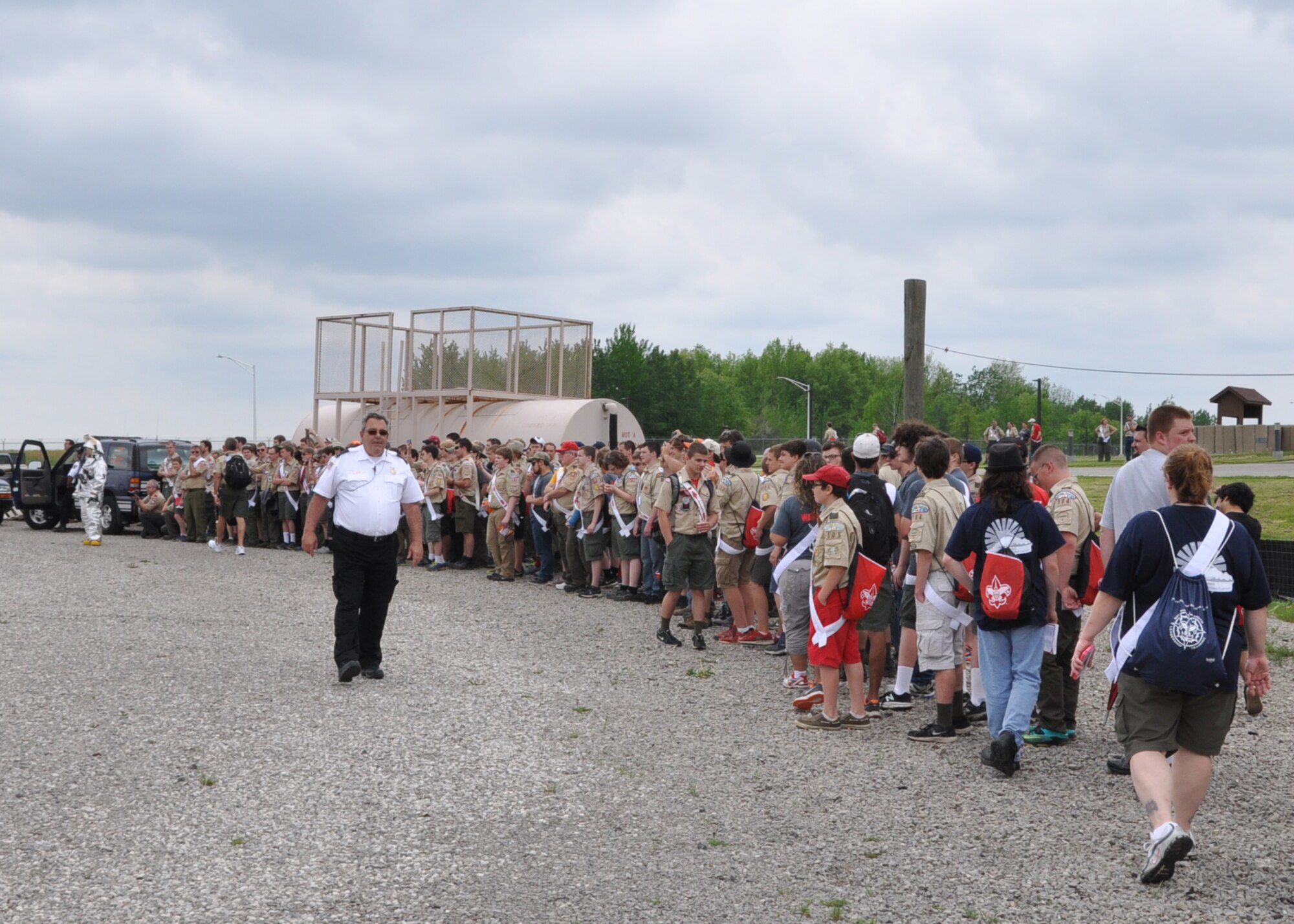 Arrowmen from the Boy Scouts of America Order of the Arrow assemble to watch a 910th Airlift Wing Civil Engineer Fire Department firefighting demonstration here May 16, 2015. Approximately 250 Scouts attended the event, experiencing the military lifestyle through several displays and demonstrations by Youngstown Air Reserve Station Personnel. (U.S. Air Force photo/Chief Master. Sgt. David Prokop)