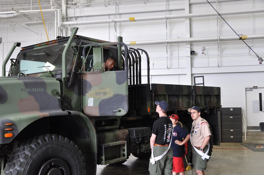 Sgt. Michael Tucker, a Marine with the Marine Corps Reserve Center here, discusses a Marine Corps vehicle with Boy Scouts of America Arrowmen during a conclave the Scouts held here May 15–17, 2015. Approximately 250 Scouts attended the event, experiencing the military lifestyle through several displays and demonstrations by Youngstown Air Reserve Station Personnel. (U.S. Air Force photo/Chief Master. Sgt. David Prokop)