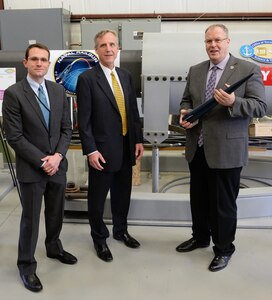 Deputy Secretary of Defense Bob Work takes a photo in front of a railgun at the during his visit to the Naval Surface Warfare Center Dahlgren Division, Dahlgren, VA on April 30, 2015.