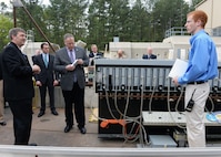 Deputy Secretary of Defense Bob Work is being briefed on the Electromagnetic Launch Facility at the Naval Surface Warfare Center Dahlgren Division, Dahlgren, VA on April 30, 2015.