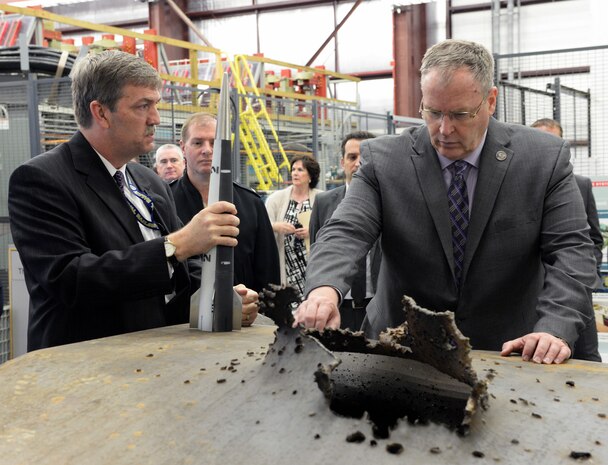 Deputy Secretary of Defense Bob Work is shown some of the damage that a hypervelocity projectile can do at during his visit to the Naval Surface Warfare Center Dahlgren Division, Dahlgren, VA on April 30, 2015.