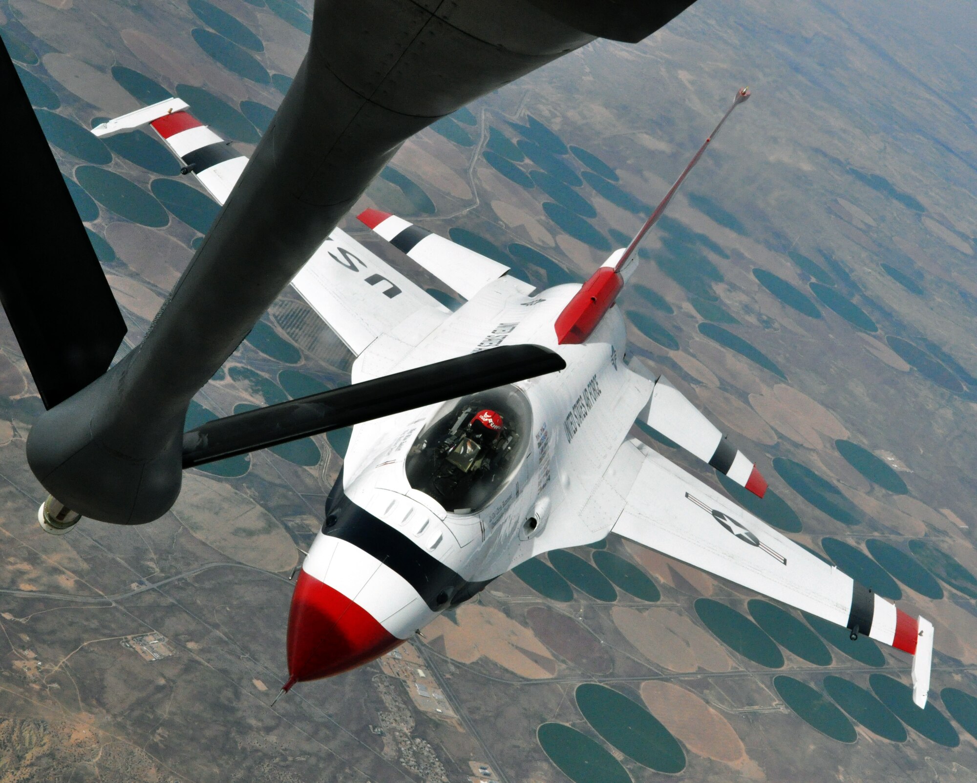 Lt. Col. Christopher Hammond, commander/leader of the U.S. Air Force Thunderbird Demonstration Squadron, maneuvers his F-16 Fighting Falcon aircraft to close in on the refueling boom of a KC-135 Stratotanker from McConnell Air Force Base, Kan., May 21, 2015.  The KC-135 was one of two McConnell tankers providing cross-country air refueling support for the Thunderbirds.  The KC-135 aircrews, all Air Force Reservists from the 931st Air Refueling Group, provided several air refuelings for the Thunderbirds, taking them from Nellis AFB, Nev., to Long Island MacArthur Airport, Islip, N.Y., ensuring the demonstration team made it to their May 23 flight demonstration at the Jones Beach Air Show in Wantagh, N.Y. (U.S. Air Force photo by Capt. Zach Anderson)