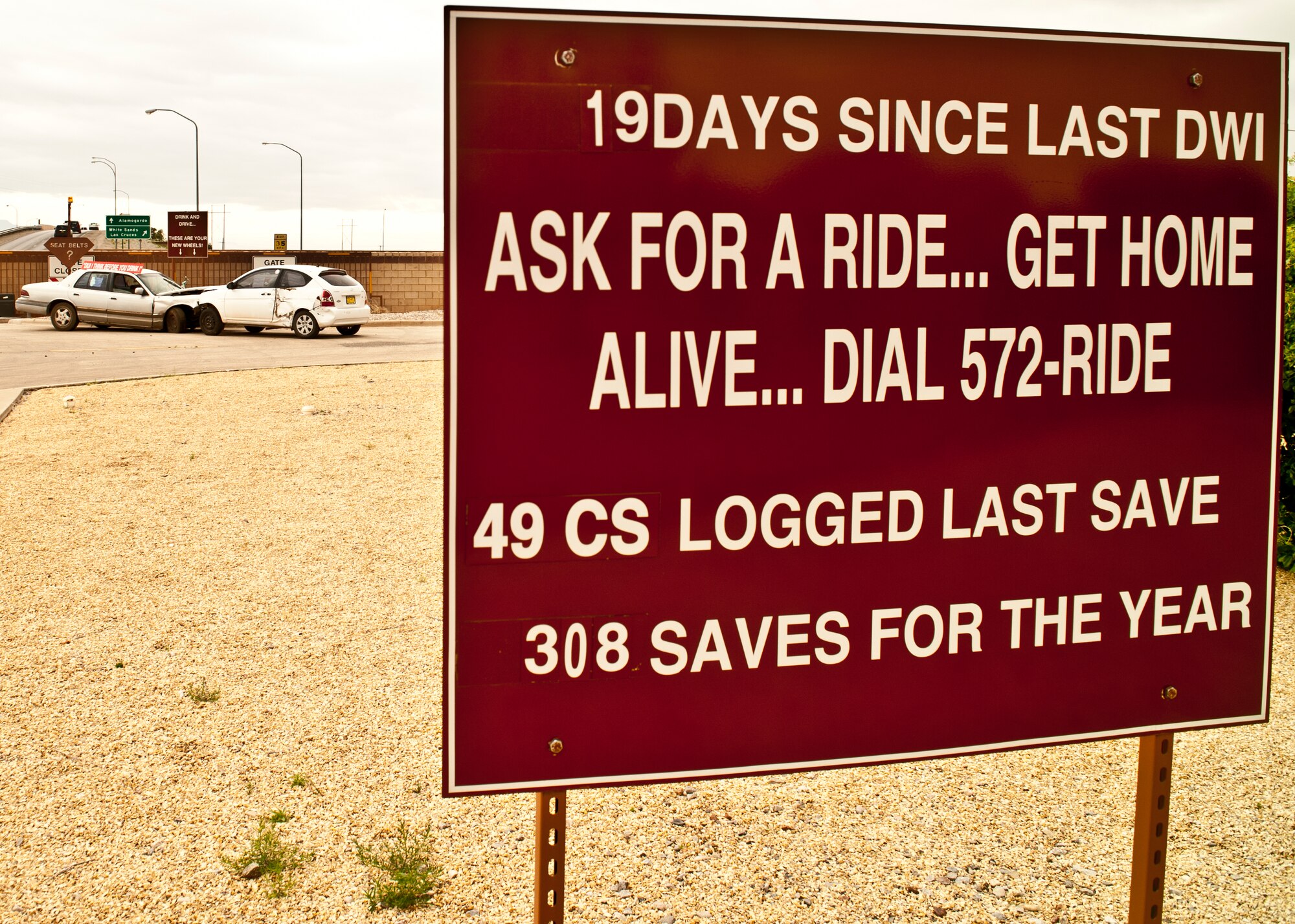 On May 21, 2015, a sign posted outside the Holloman Air Force Base, N.M., main gate states how long it has been since the last drunk driving incident, and how many lives were saved through responsible decisions. With the weather warming up and summer vacations kicking off, it is important for military members to remember safety and the wingman concept. Saving a life is as easy as taking keys at the door of a party and having designated drivers on standby. Holloman also has a program called 572-RIDE. Each weekend, Airmen from all around Holloman volunteer their time and gas to give rides to those who have been drinking, and do not have a ride home. To reach 572-RIDE you can call 575-572-7433 or 575-572-1110 ext. 5. (U.S. Air Force Photo by Senior Airman Chase Cannon/ Released)   