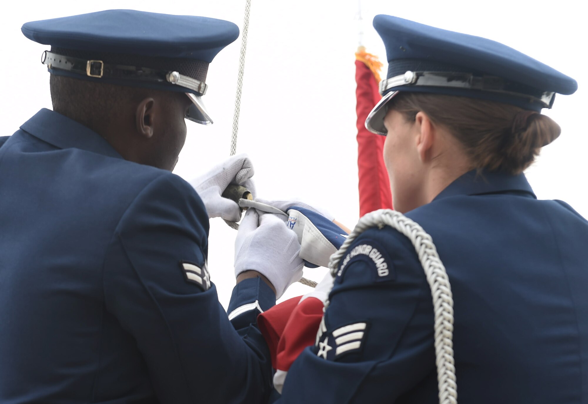 The Mile High Honor Guard retreat the colors during Buckley Air Force Base’s Memorial Day ceremony May 21, 2015, at the headquarters building on Buckley AFB, Colo. The ceremony included a formation, a guest speaker who spoke on his experiences during the Vietnam War, and a retreat ceremony. (U.S. Air Force photo by Airman 1st Class Samantha Meadors/Released)