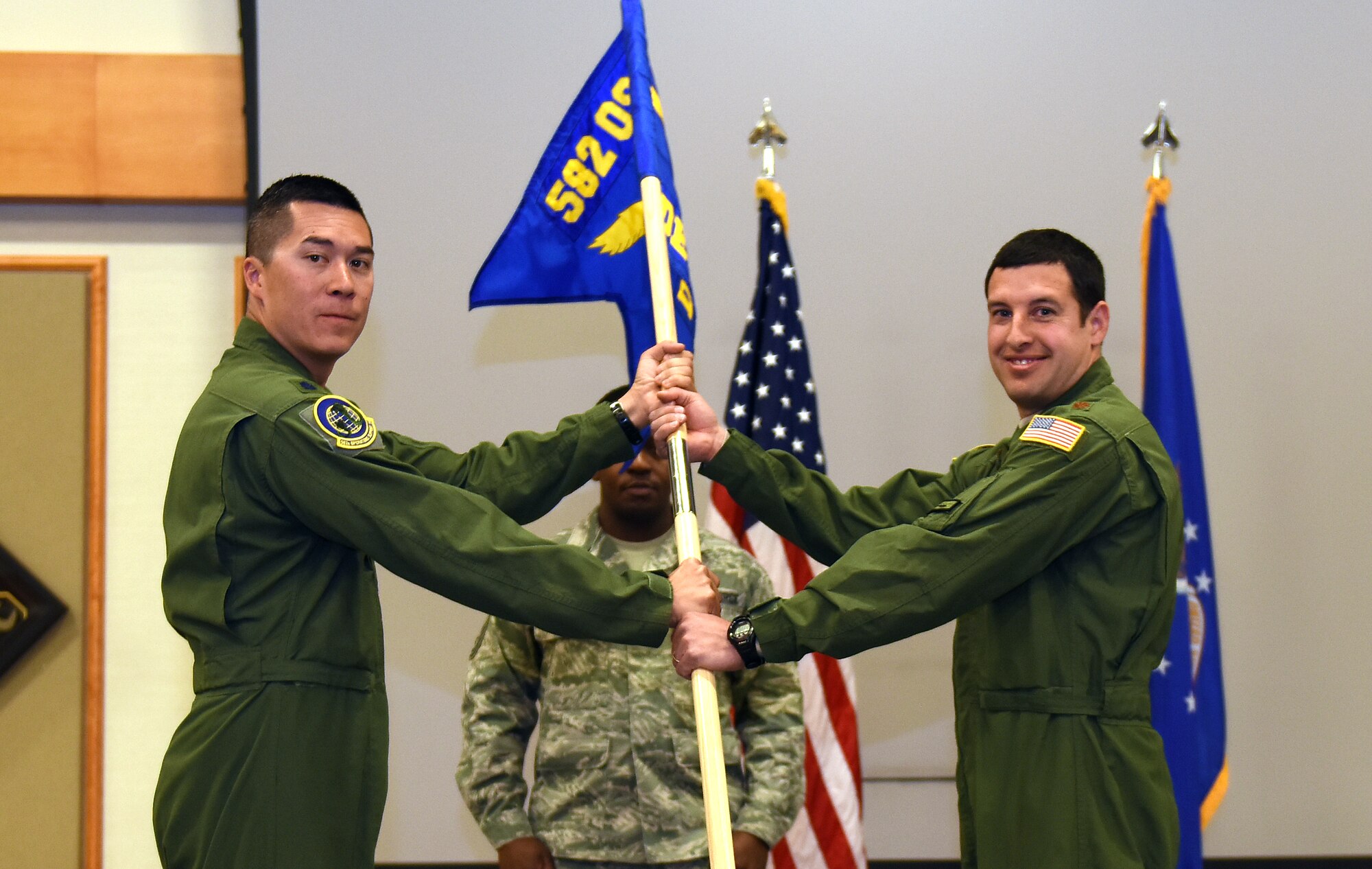 Maj. Terry Martin accepts command of the 582nd Operations Support Squadron Detachment 4 from Lt. Col. James Blanchard, 582nd OSS commander, May 21, 2015, at Malmstrom Air Force Base, Mont. The 582nd OSS reported to the first ever Air Force helicopter group activated March of this year. (U.S. Air Force photo/Chris Willis)
