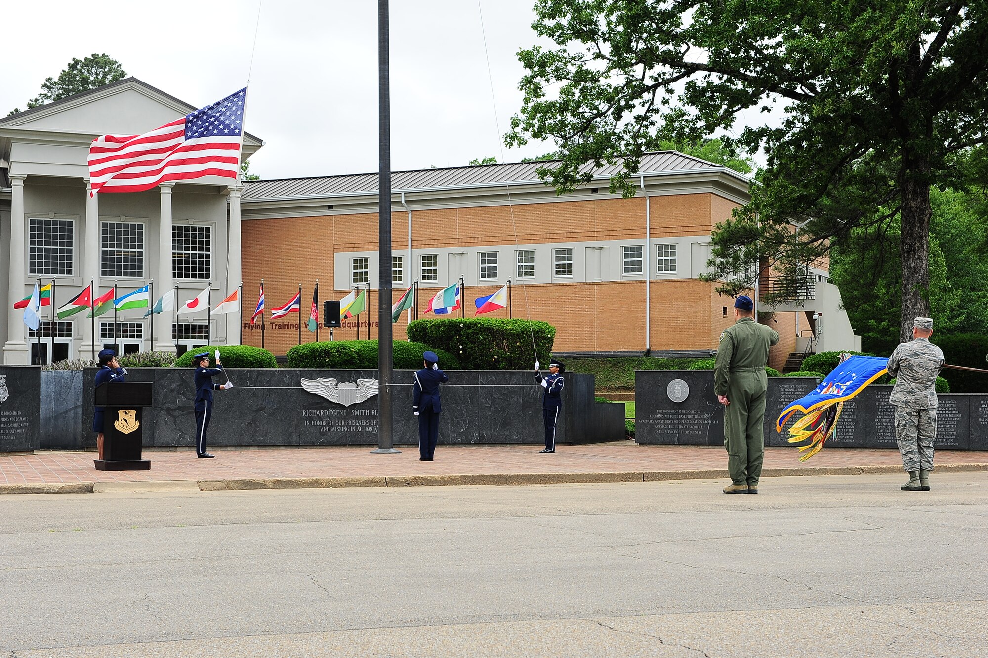 Columbus Air Force Base Airmen salute the flag as it is being lowered May 21 during a Memorial Day ceremony at Smith Plaza on Columbus Air Force Base, Mississippi. Memorial Day is an opportunity to remember the sacrifices of Airmen who made the ultimate sacrifice to secure our freedoms. (U.S. Air Force photo/Airman Daniel Lile)