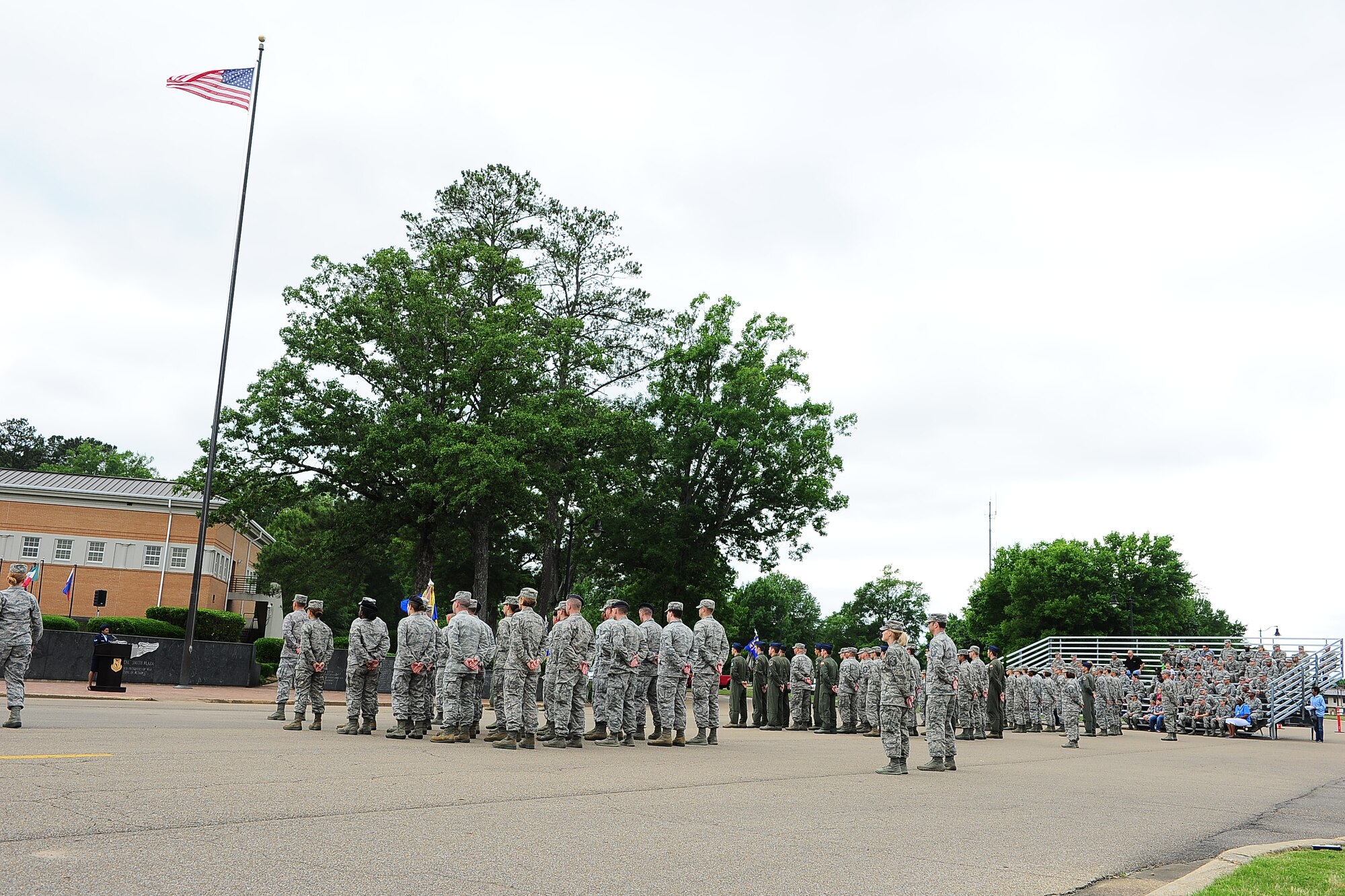 Columbus Air Force Base Airmen stand at parade rest at the beginning of a Memorial Day retreat ceremony May 21 on Columbus Air Force Base, Mississippi. The formal retreat ceremony concluded with a firing party and the playing of Taps.  (U.S. Air Force photo/Airman Daniel Lile)