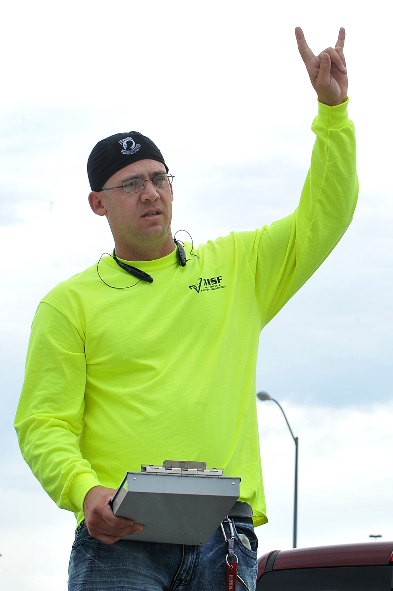 U.S. Air Force Tech. Sgt. Edward Lotz, 55th Aircraft Maintenance Squadron, displays proper hand signaling used for group riding before his group of motorcyclist departs Offutt AFB, Neb., May 15. The training was conducted as a refresher for experienced riders but was also required in order to meet DOD regulations outlined in AFI 91-207. (U.S. Air Force photo by Charles J. Haymond/Released)