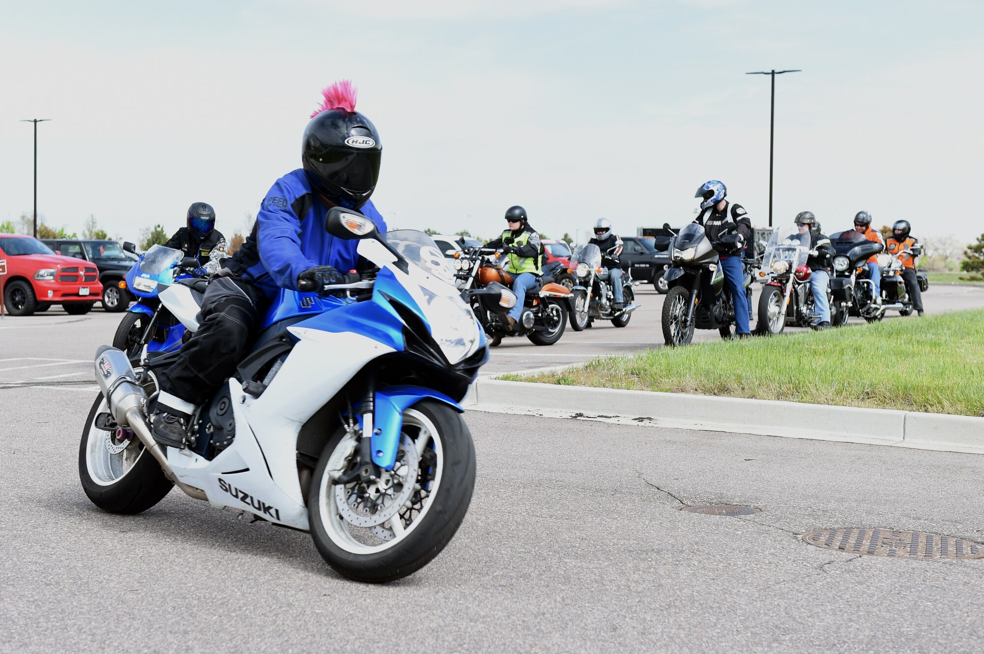 Team Buckley members take off for the starting point of their ride during their safety ride May 15, 2015, on Buckley Air Force Base, Colo. The 460th SCS had this motorcycle ride to give “on-the-job” training to ensure young members of the squadron know how to ride safely. (U.S. Air Force photo by Airman 1st Class Emily E. Amyotte/Released)