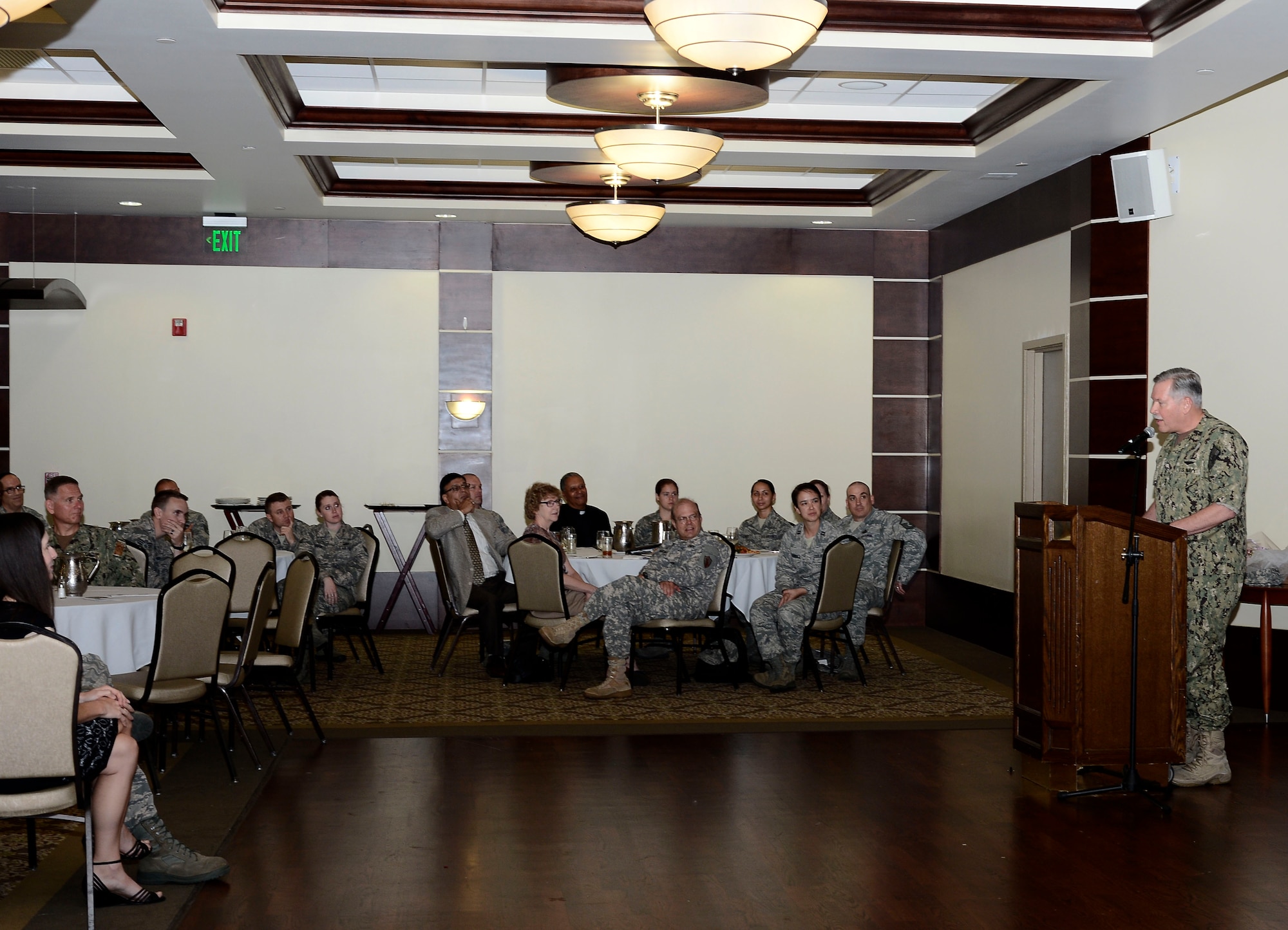 Members of Team MacDill listen to Vice Adm. Mark Fox, U.S. Central Command deputy commander, during a spiritual resiliency luncheon at MacDill Air Force Base, Fla., May, 20, 2015. Fox related aviation and the military to being spiritually resilient. (U.S. Air Force photo by Senior Airman Tori Schultz/Released)