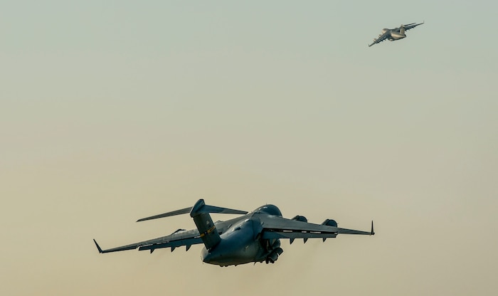 U.S. Air Force C-17 Globemaster III's take off from Joint Base Charleston, S.C. May 21, 2015 during exercise CRESCENT REACH 15. This exercise tested and evaluated Joint Base Charleston's ability to launch a large aircraft formation in addition to processing and deploying duty passengers and cargo in response to a simulated crisis abroad. The 437th Airlift Wing launched 11 aircraft as part of the multi-ship formation that flew to Pope AFB, North Carolina. There they joined four additional C-17s, six C-130s, E-8 JSTARS and two F-16s to participate in the 82nd Airborne Division's All American Week. During their time there, more than 1,400 paratroopers and critical equipment, such as HUMVEES and artillery, were dropped to simulate a Joint Forcible Entry of the Global Response Force. All American Week is the Division's premiere event to maintain close ties with Division Veteran's as well as celebrate heritage and unit cohesion. (U.S. Air Force photo by Senior Airman Nicholas Byers)