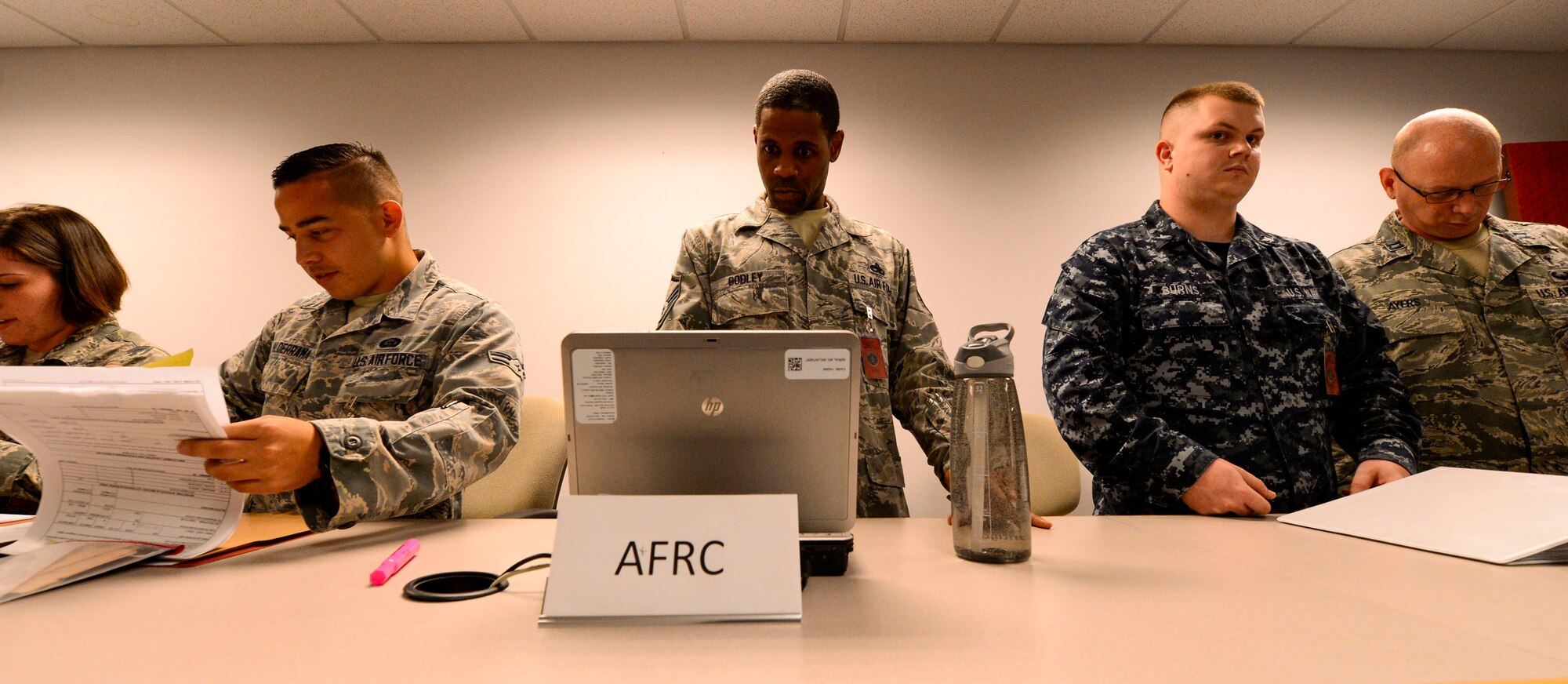 U.S. Air Force Master Sgt. David Godley, 628th Force Support Squadron, assists with a deployment line during Exercise Crescent Reach 15, May 19, 2015. This local exercise, which lasted from 18-21 May, 2015, tested and evaluated Joint Base Charleston's ability to launch a large aircraft formation in addition to process and deploying duty passengers and cargo in response to a simulated crisis abroad. U.S. Air Force photo by Senior Airman Nicholas Byers)