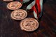 Medals are placed on a table to be handed out to winners of the 400 meter relay in the Special Olympics D.C. Summer Games at The Catholic University of America in Washington D.C., May 20, 2015. Special Olympics D.C. has been part of the Special Olympics movement since its start in 1968. (U.S. Air Force photo/Michael Martin)