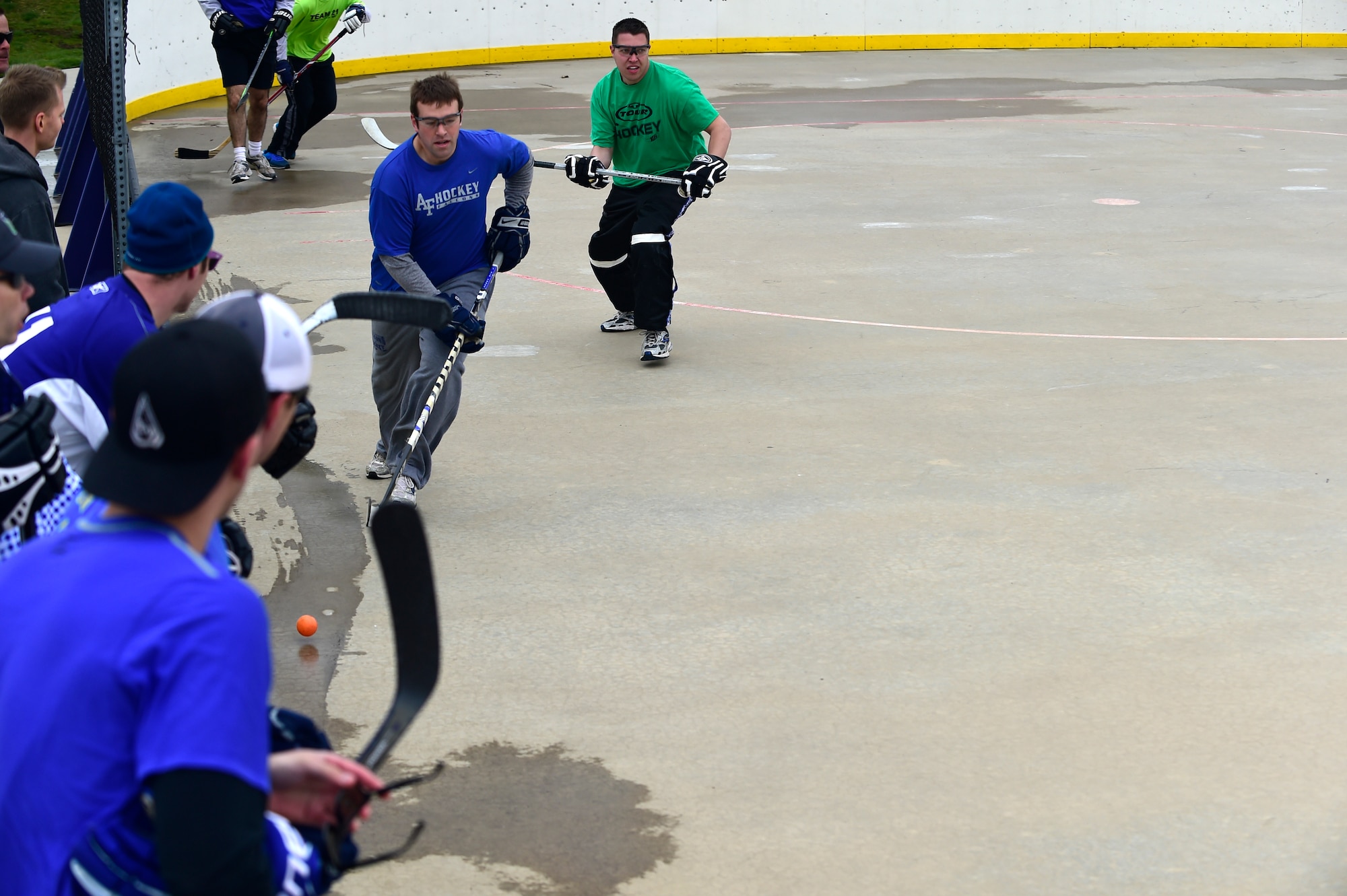 Peterson Air Force Base, Colo. and Shriever AFB, Colo., ball hockey players compete against each other for 1st place during the Tri-Wing Sports Day competition May 20, 2015, on Buckley AFB, Colo. Tri-Wing Sports Day is held once a year between the three Air Force Space Command bases and is intended to promote healthy, active lifestyles and friendly competition. The bases competed against each other in over 15 sports such as volleyball, football, tennis and softball among others. (U.S. Air Force photo by Staff Sgt. Stephany Richards/Released)