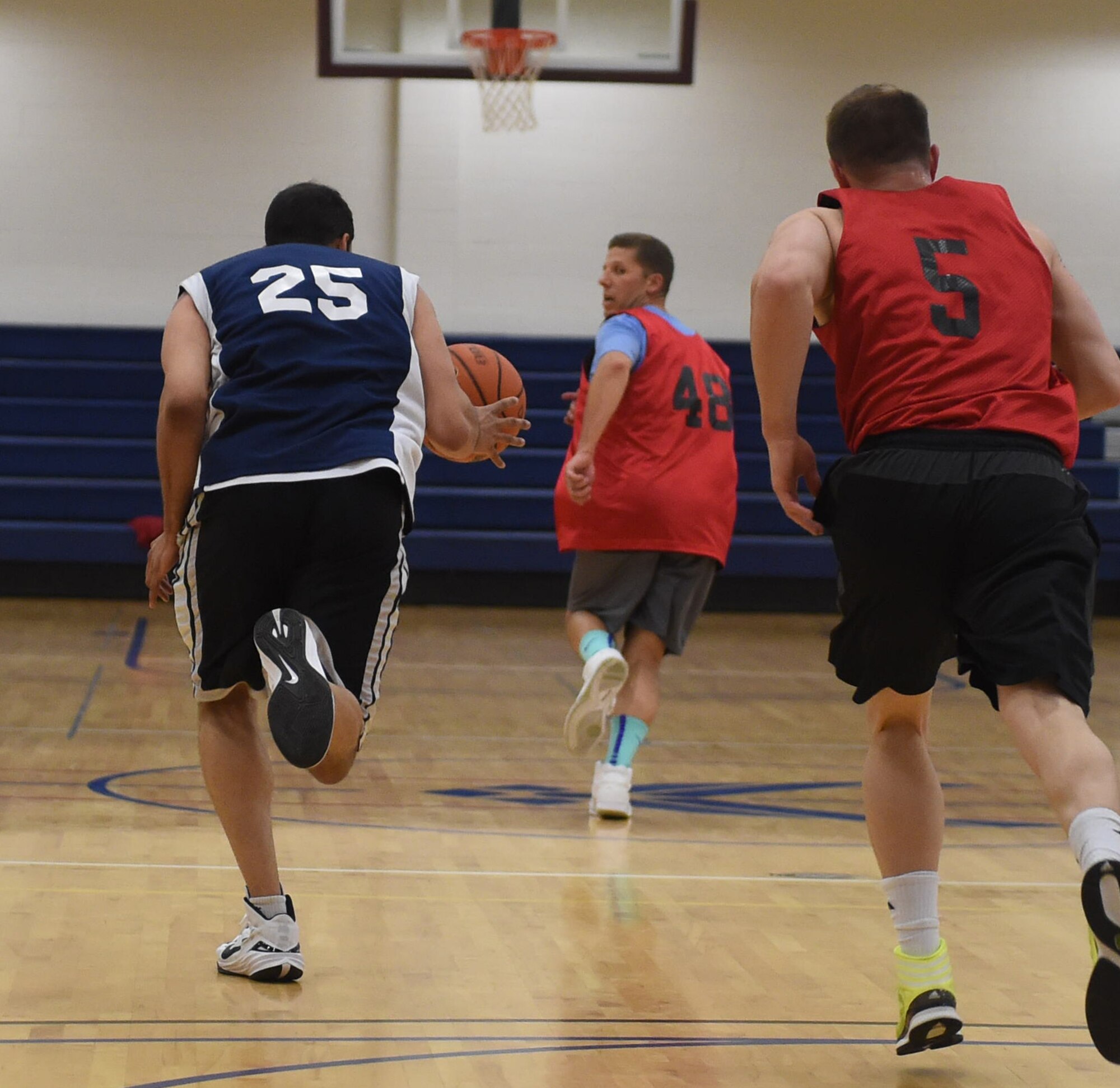 Basketball players compete against each other for 1st place during the Tri-Wing Sports Day competition May 20, 2015, on Buckley Air Force Base, Colo. Tri-Wing Sports Day is held once a year between the three Air Force Space Command bases and is intended to promote healthy, active lifestyles and friendly competition. The bases competed against each other in over 15 sports such as volleyball, football, tennis and softball among others. (U.S. Air Force photo by Airman 1st Class Samantha Meadors/Released)