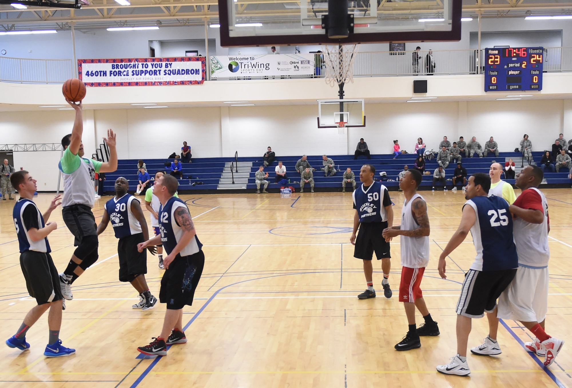 Buckley Air Force Base, Colo., and Peterson AFB, Colo., compete against each other for first place in Basketball during the Tri-Wing Sports Day competition May 20, 2015, on Buckley AFB, Colo. Tri-Wing Sports Day is held once a year between the three Air Force Space Command bases and is intended to promote healthy, active lifestyles and friendly competition. The bases competed against each other in over 15 sports such as volleyball, football, tennis and softball among others. (U.S. Air Force photo by Airman 1st Class Samantha Meadors/Released)