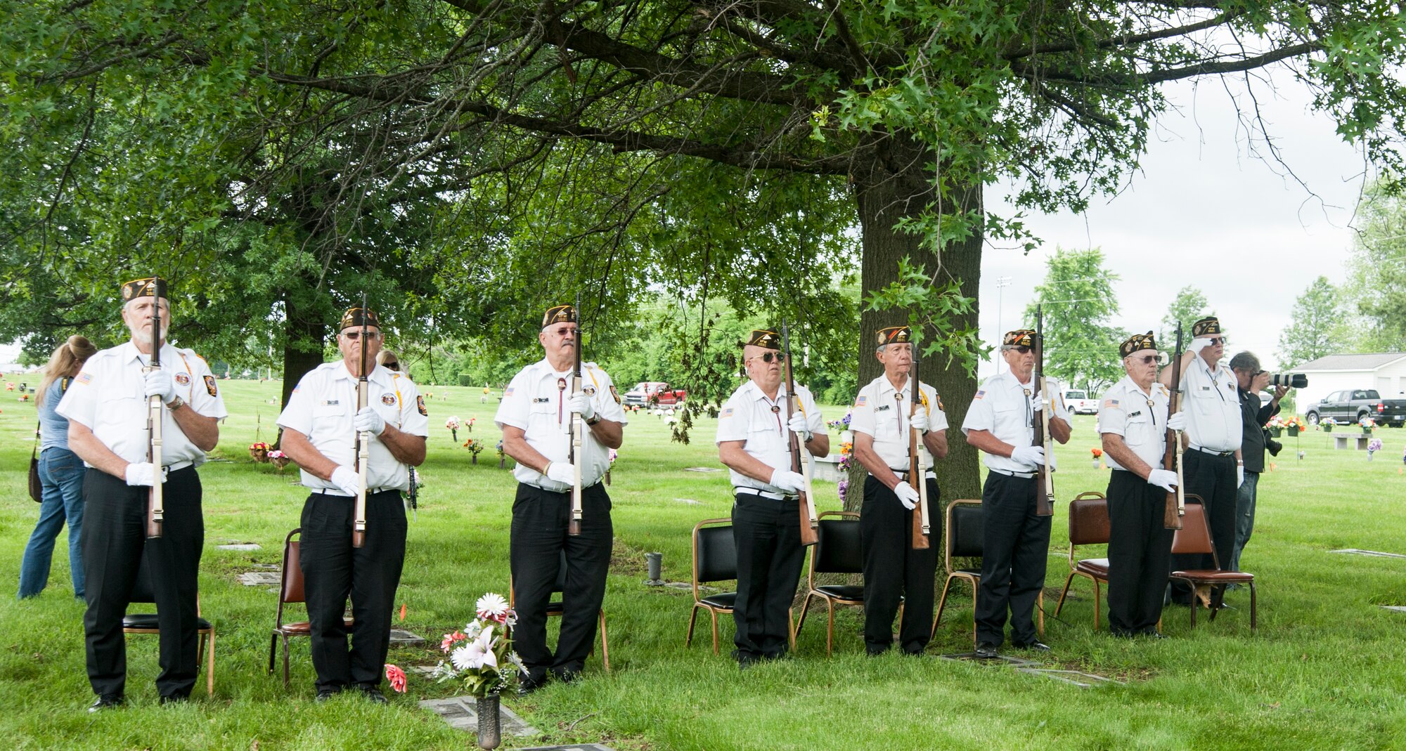 Veterans of Foreign Wars from Chapter 2591stand at attention after firing a three-rifle volley during the annual wreath-laying ceremony at the grave of 2nd Lt. George Whiteman May 16, 2015, in Sedalia, Mo. Each year, veterans around the area attend the ceremony to honor the ultimate sacrifice that the lieutenant made when he became one of the first Airmen to die during World War II.  (U.S. Air Force photo by Staff Sgt. Brigitte N. Brantley/Released)