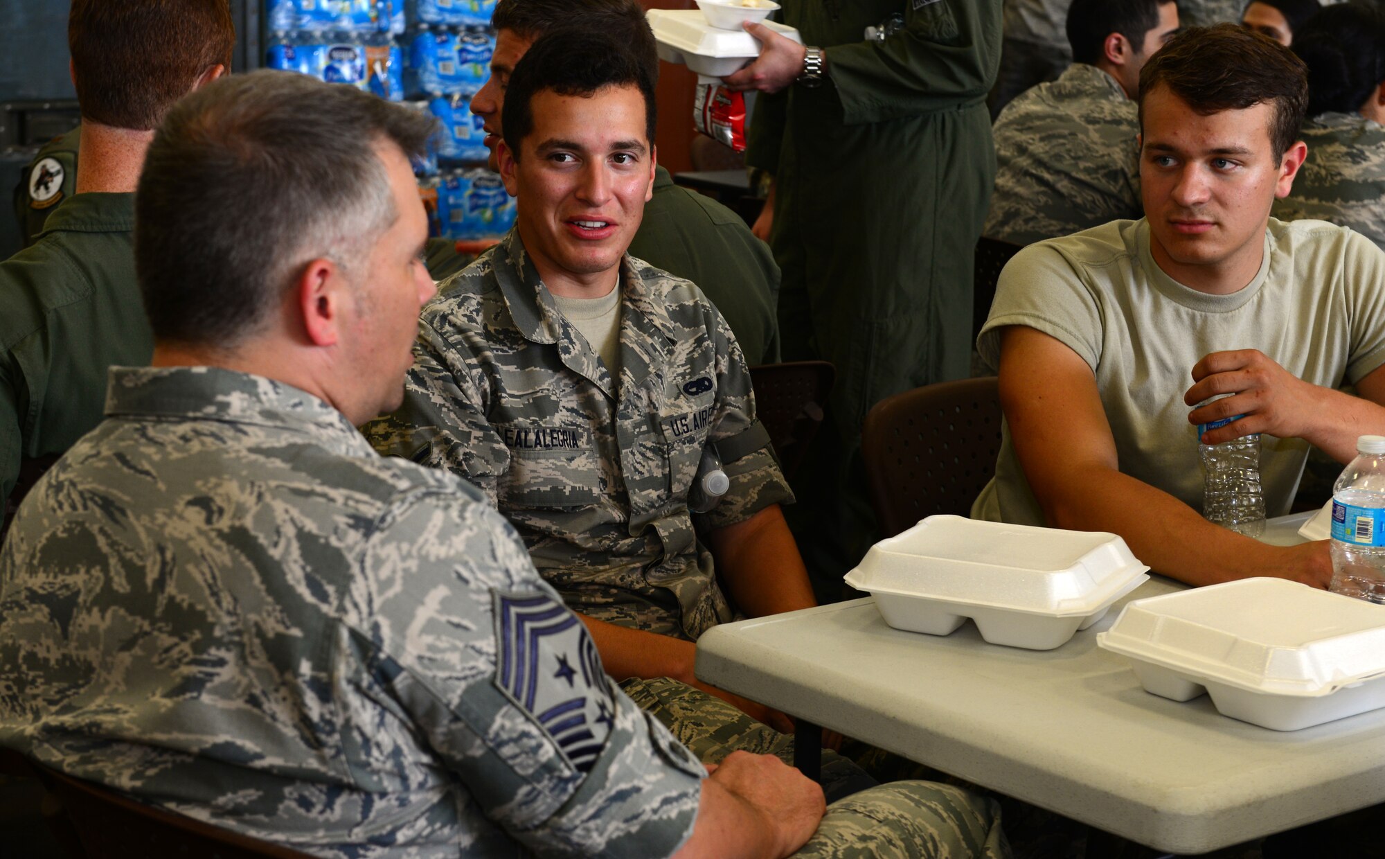 Chief Master Sgt. Tommy Mazzone, 2nd Bomb Wing command chief, visits Airmen at the Chaplain Corp cookout on Barksdale Air Force Base, Louisiana, May 20, 2015. The cookout was an opportunity for Airmen to eat, relax and socialize. (U.S. Air Force Photo/Airman 1st Class Luke Hill)