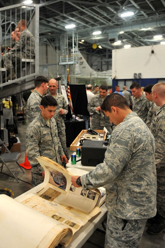 Dozens of booths, adorned with squadron heritage, line the area just behind the bleachers for the annual Tales of the 55th heritage ceremony held at the Bennie Davis Maintenance Facility on May 15, Offutt Air Force Base, Neb. (U.S. Air Force photo by Josh Plueger/Released)