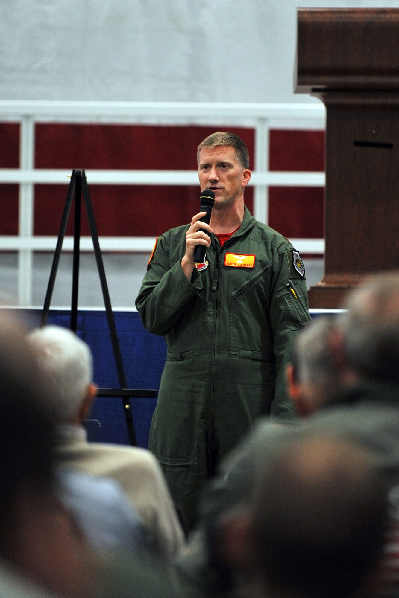 U.S. Air Force Maj. Rustin LaFurney, 97th Intelligence Squadron director of operations, spoke about the many changes he’s seen within the 55th Wing throughout his twenty year career at the annual Tales of the 55th ceremony at the Bennie Davis Maintenance Facility on May 15, Offutt Air Force Base, Neb.  Stories, from all perspectives, are shared with fellow members of the Fightin’ Fifty-Fifth to strengthen the connection between the present day and the wing’s rich heritage.  (U.S. Air Force photo by Josh Plueger/Released)