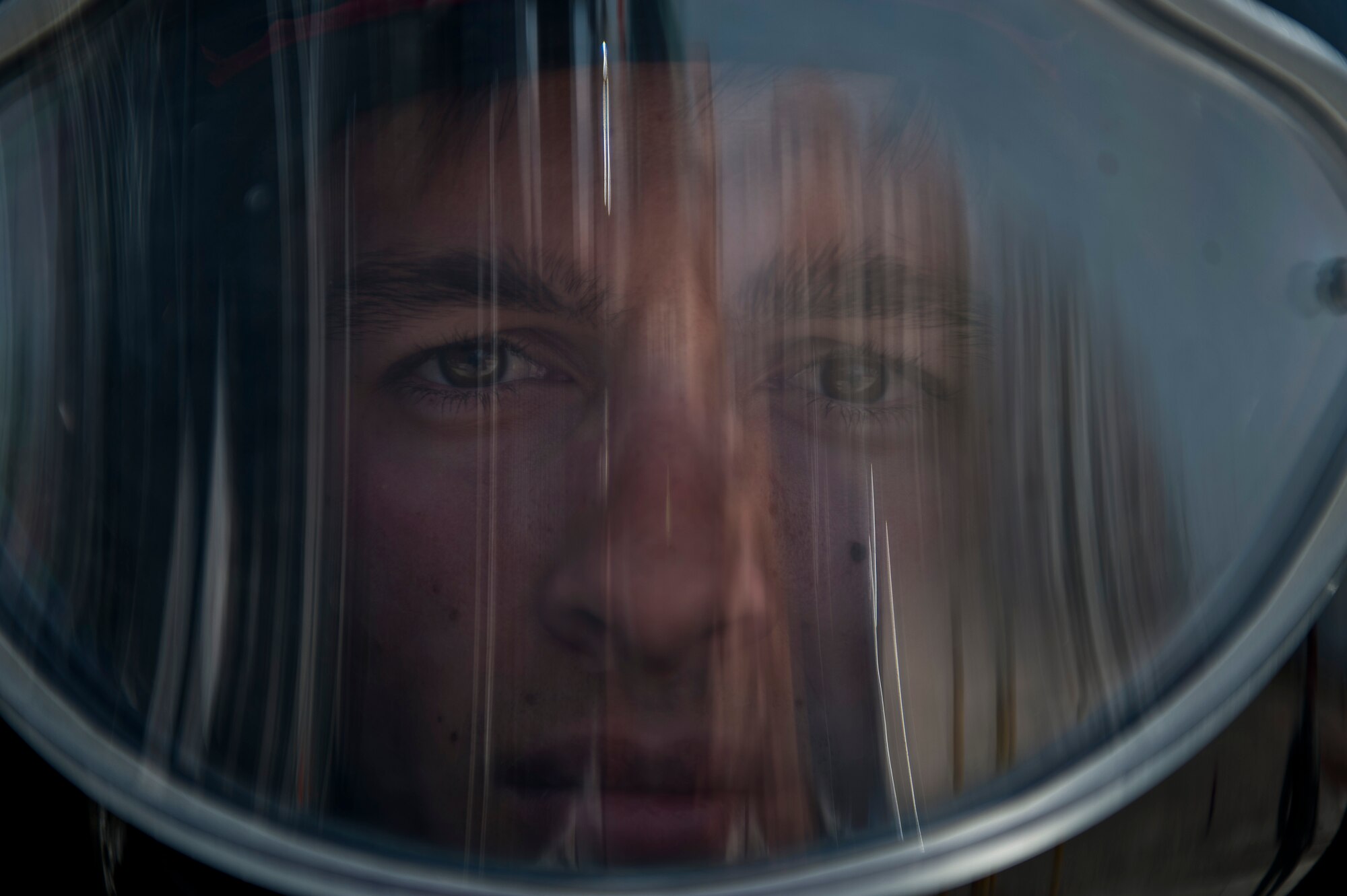 Senior Airman Kalin Fuller, 99th Civil Engineer Squadron explosive ordnance disposal journeyman looks out from inside of EOD’s bomb suit at Nellis Air Force Base, Nev., May 13, 2015. Before Airmen at EOD deploy, they will run through deployed improvised explosive device scenarios, train on mine detectors and electronic countermeasure. (U.S. Air Force photo by Airman 1st Class Jake Carter)