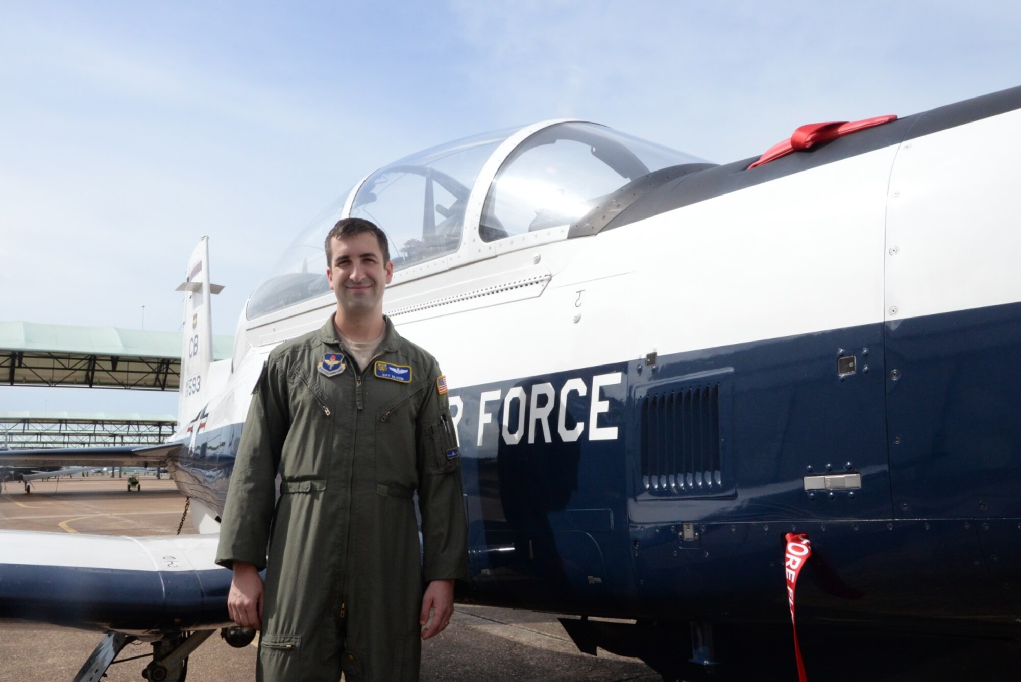Capt. Daniel Bloom, 37th Fighter Squadron Instructor Pilot, stands next to a T-6 Texan, one of the aircraft he flies. Bloom came to Columbus Air Force Base, Mississippi, in 2012 only to discover it was the same place his great-uncle had learned to fly in the Army Air Corps. (U.S. Air Force photo/2nd Lt. Lauren Woods)