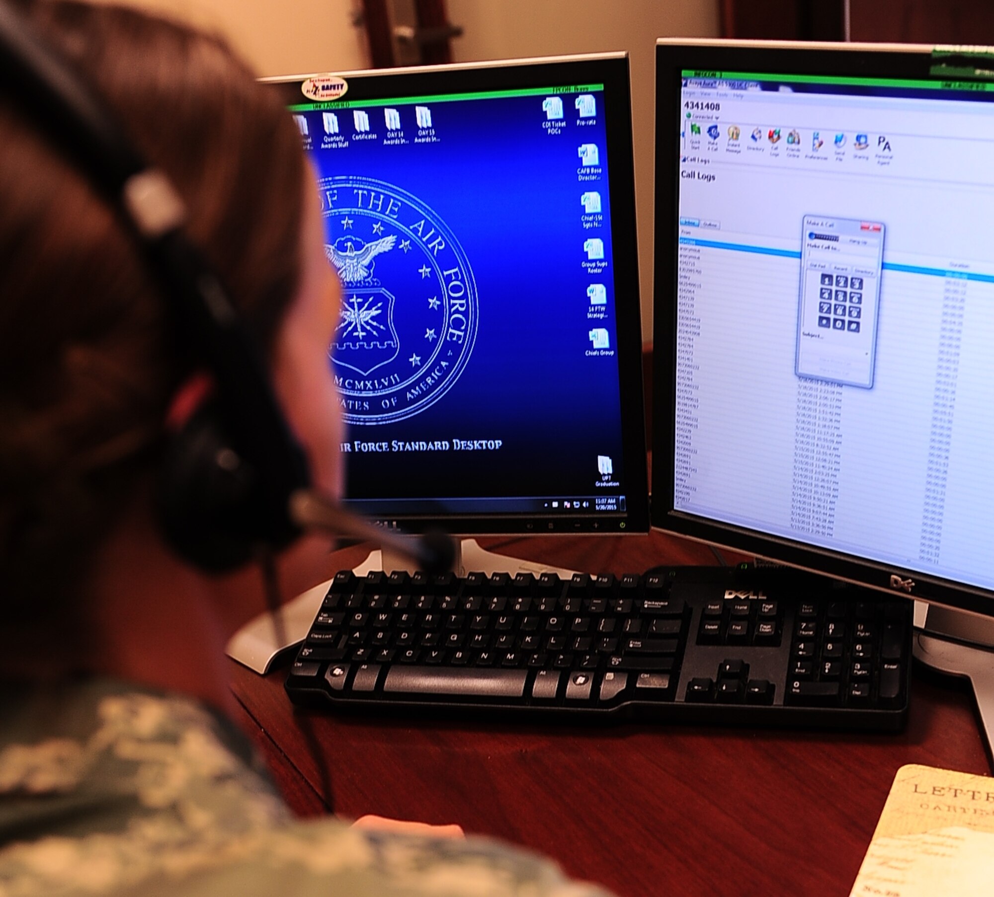 Senior Airman Sarah Bruce, 14th Flying Training Wing Command Chief Executive Assistant, places a call using a Voice over Internet Protocol headset May 20 at Columbus Air Force Base, Mississippi. By June 6, all the telephones on Columbus will be converted to VoIP systems. (U.S. Air Force photo/Airman Daniel Lile)