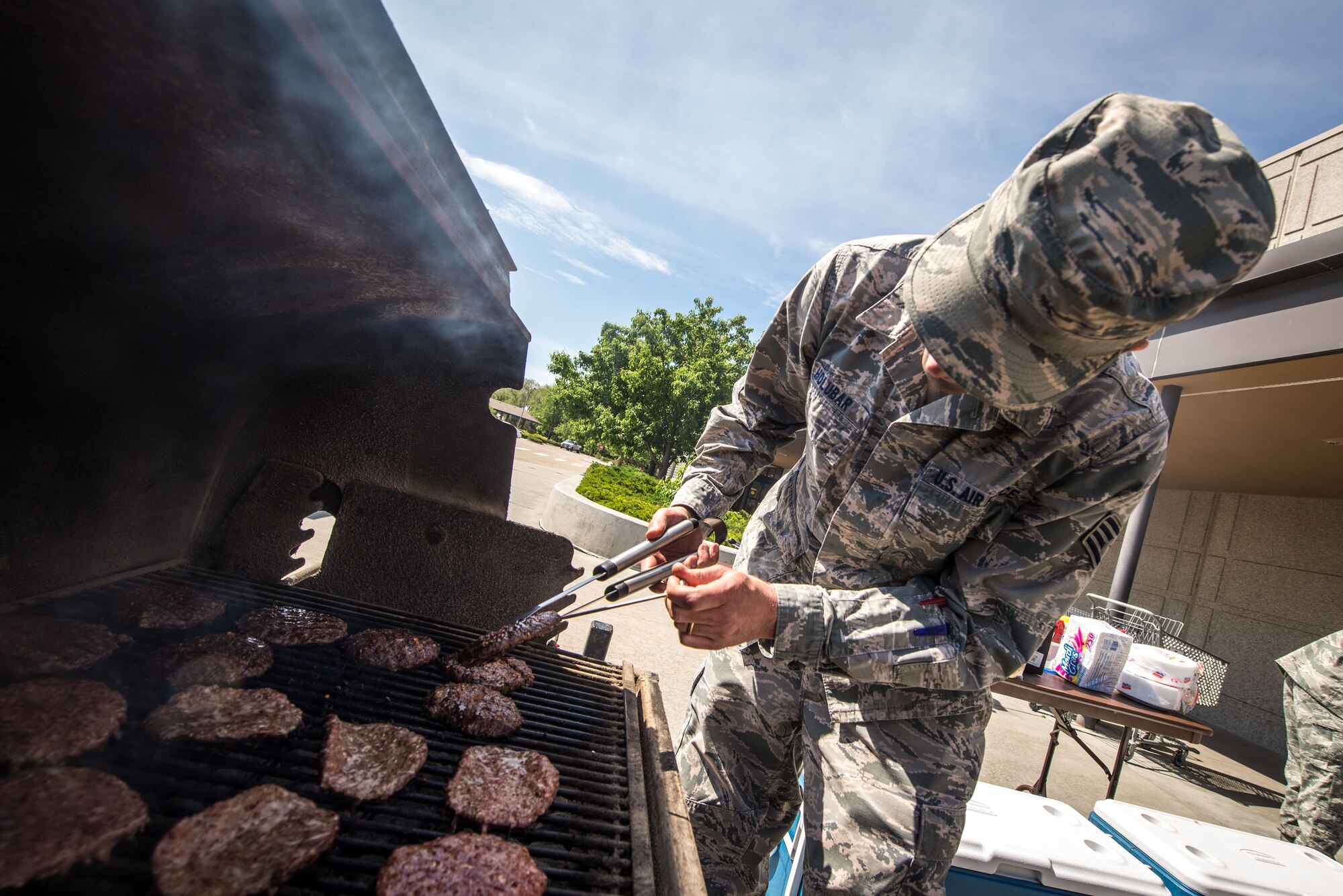 Airmen from the 366th Public Health Flight grilled burgers and hot dogs for visitors at the base exchange May 21, 2015 at Mountain Home Air Force Base, Idaho. Public Health hosted the event to educate Airmen and their families about proper food cooking and handling techniques. (U.S. Air Force Photo by Airman 1st Class Connor J. Marth/RELEASED)