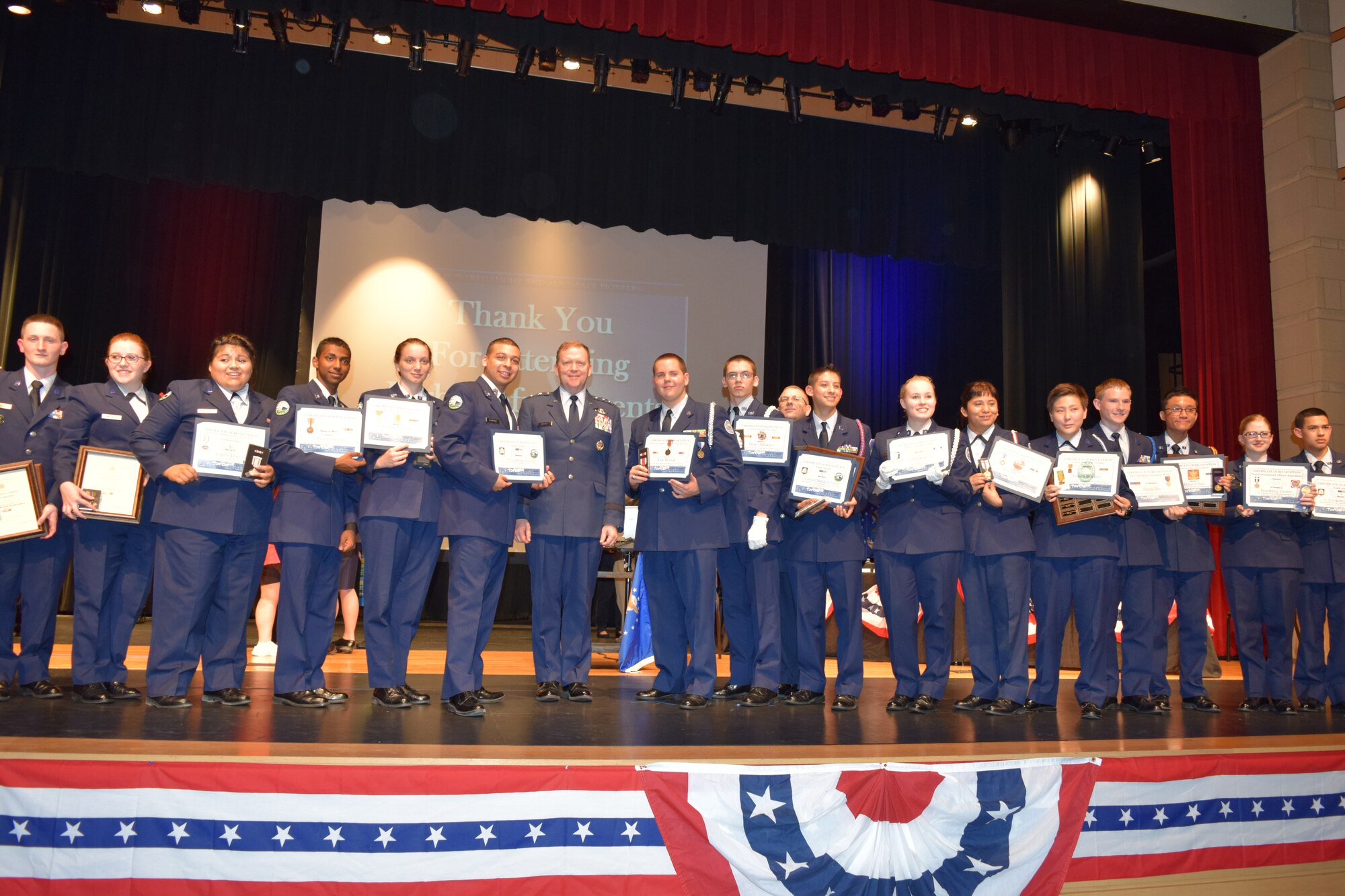 NAVAL AIR STATION FORT WORTH JOINT RESERVE BASE, Texas -- Maj. Gen. Richard Scobee, 10th Air Force commander, presented nearly 40 Air Force Junior Reserve Officer Training Corps awards May 8 to Eagle Mountain-Saginaw Independent School District cadets during their 5th Annual Awards Ceremony at Saginaw High School, Saginaw, Texas. After the general delivered an engaging and motivating speech, he personally recognized each cadet on their accomplishments for their annual and national sponsored awards. (Courtesy photos)
