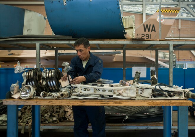 Senior Airman Herbert Ferreira, 57th Aircraft Maintenance Squadron Viper Aircraft Maintenance Unit crew chief, tags aircraft parts at Nellis Air Force Base, Nev., May 18, 2015. Crew chiefs are responsible for overseeing the day-to-day maintenance of aircraft, including diagnosing malfunctions and replacing components, and conducting various inspections to ensure the aircraft is functioning properly. (U.S. Air Force photo by Staff Sgt. Siuta B. Ika)