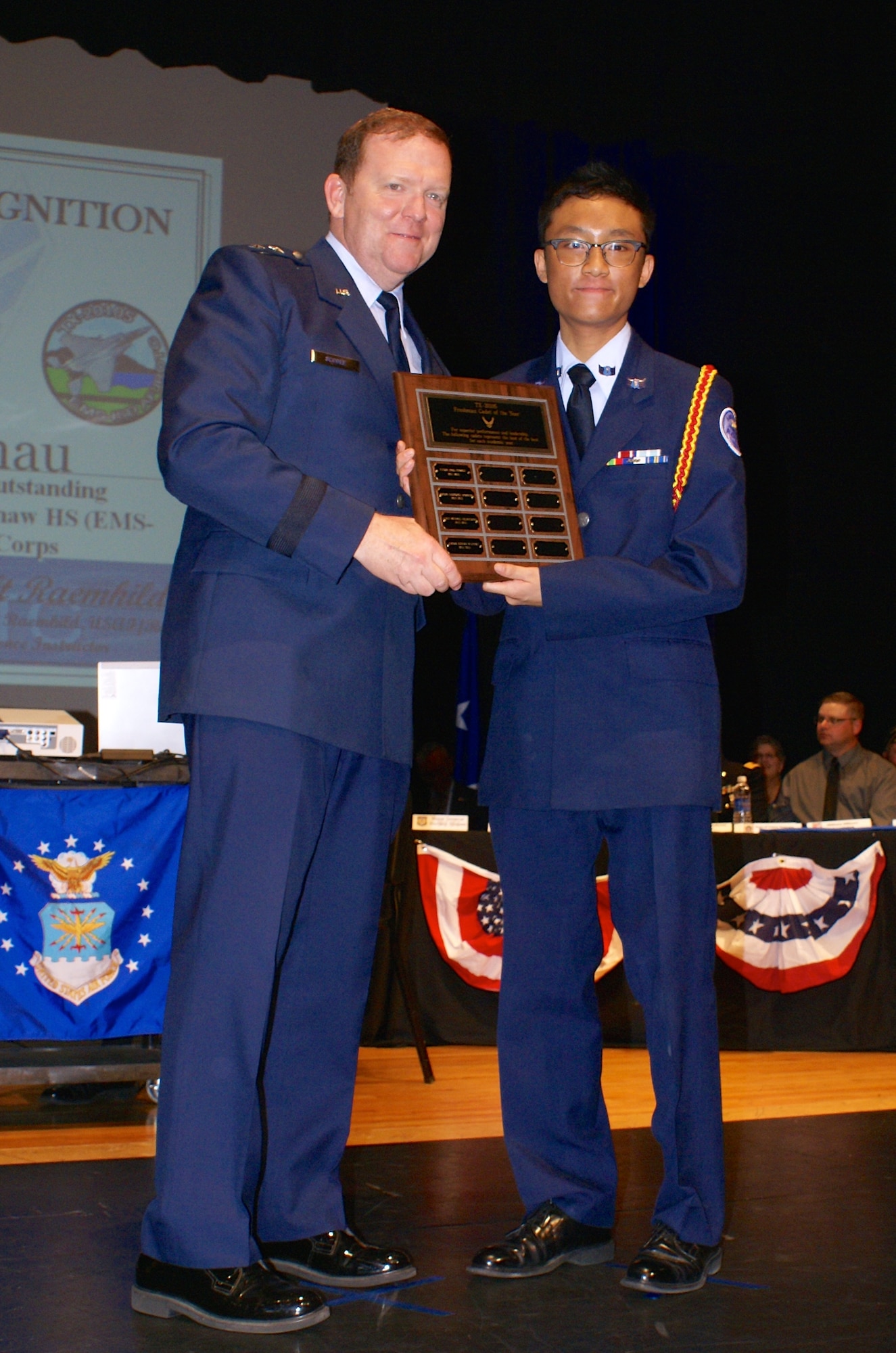 NAVAL AIR STATION FORT WORTH JOINT RESERVE BASE, Texas -- Maj. Gen. Richard Scobee, 10th Air Force commander, presented nearly 40 Air Force Junior Reserve Officer Training Corps awards May 8 to Eagle Mountain-Saginaw Independent School District cadets during their 5th Annual Awards Ceremony at Saginaw High School, Saginaw, Texas. After the general delivered an engaging and motivating speech, he personally recognized each cadet on their accomplishments for their annual and national sponsored awards including the Top 1st Year Cadet Award to  Cadet Senior Airman Ethan Chau. (Courtesy photos)