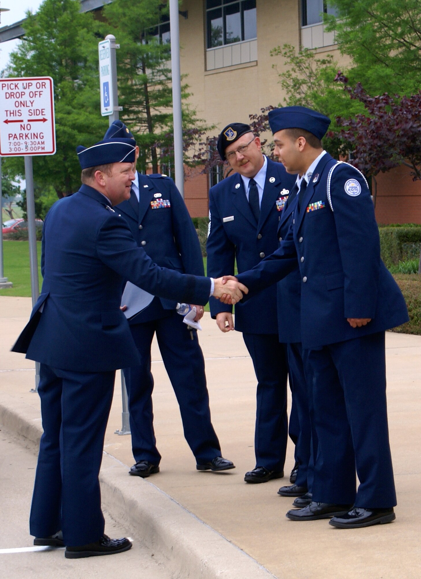 NAVAL AIR STATION FORT WORTH JOINT RESERVE BASE, Texas -- Maj. Gen. Richard Scobee, 10th Air Force commander, is greeted by Eagle Mountain-Saginaw Independent School District Air Force Junior Reserve Officer Training Corp representatives prior to presenting nearly 40 AFJROTC awards May 8 during their 5th Annual Awards Ceremony in Saginaw, Texas. After the general delivered an engaging and motivating speech, he personally recognized each cadet on their accomplishments for their annual and national sponsored awards. (Courtesy photos)