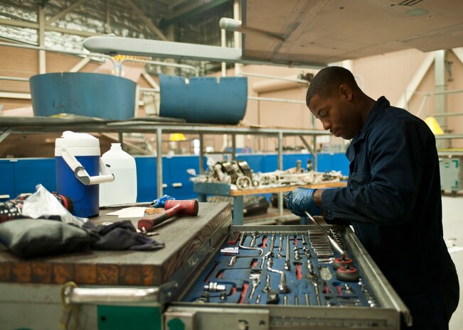 Senior Airman Michael Ford, 57th Aircraft Maintenance Squadron Viper Aircraft Maintenance Unit crew chief, looks for a tool at Nellis Air Force Base, Nev., May 18, 2015. Maintainers in the 57th Maintenance Group have access to any tool they need to finish a job. (U.S. Air Force photo by Staff Sgt. Siuta B. Ika)