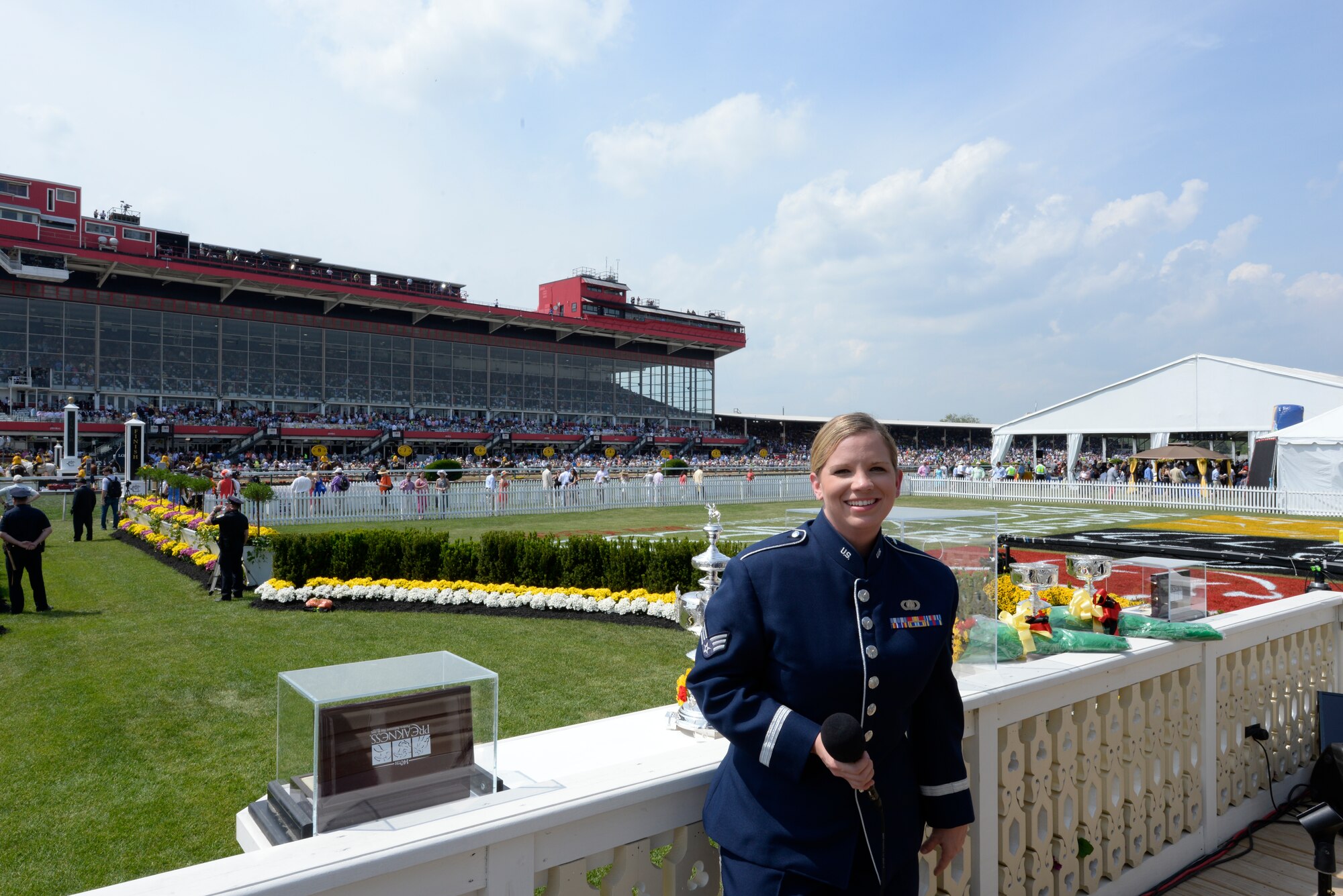 Senior Airman Melissa Lackore performs "America the Beautiful" for a record crowd at the Preakness Stakes May 16, 2015 in Baltimore, Maryland. Lackore is a member of the newest ensemble of the Heritage of America Band, Full Spectrum. The event, which was nationally televised, broke records in attendance by hosting more than 170,000 people. (U.S. Air Force photo by Tech. Sgt. Steve Stanley/Released)