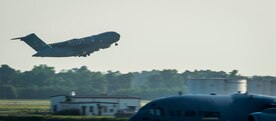 A C-17 Globemaster III takes off May 21, 2015, at Joint Base Charleston, S.C. during exercise Crescent Reach 2015. The exercise tested JB Charleston’s ability to launch a large aircraft formation and mobilize a large amount of cargo and passengers. (U.S. Air Force photo/Senior Airman Jared Trimarchi)