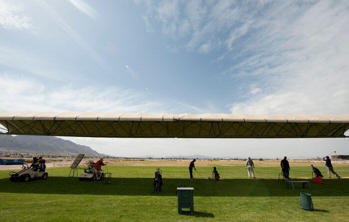 Participants in the Professional Golfers’ Association of America Hope Program practice their swing at the driving range on Nellis Air Force Base, Nev., May 14, 2015. The PGA Hope Program is designed to help introduce or reintroduce disabled veterans to golf and help them work around any physical limitations they might have. (U.S. Air Force photo by Airman 1st Class Mikaley Towle)