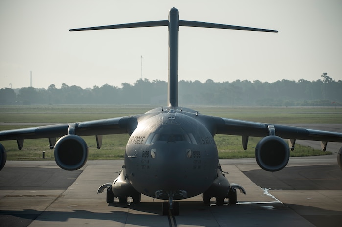 A C-17 Globemaster III waits on the flightline May 21, 2015, at Joint Base Charleston, S.C. during exercise Crescent Reach 2015. The exercise tested JB Charleston’s ability to launch a large aircraft formation and mobilize a large amount of cargo and passengers. (U.S. Air Force photo/Senior Airman Jared Trimarchi)