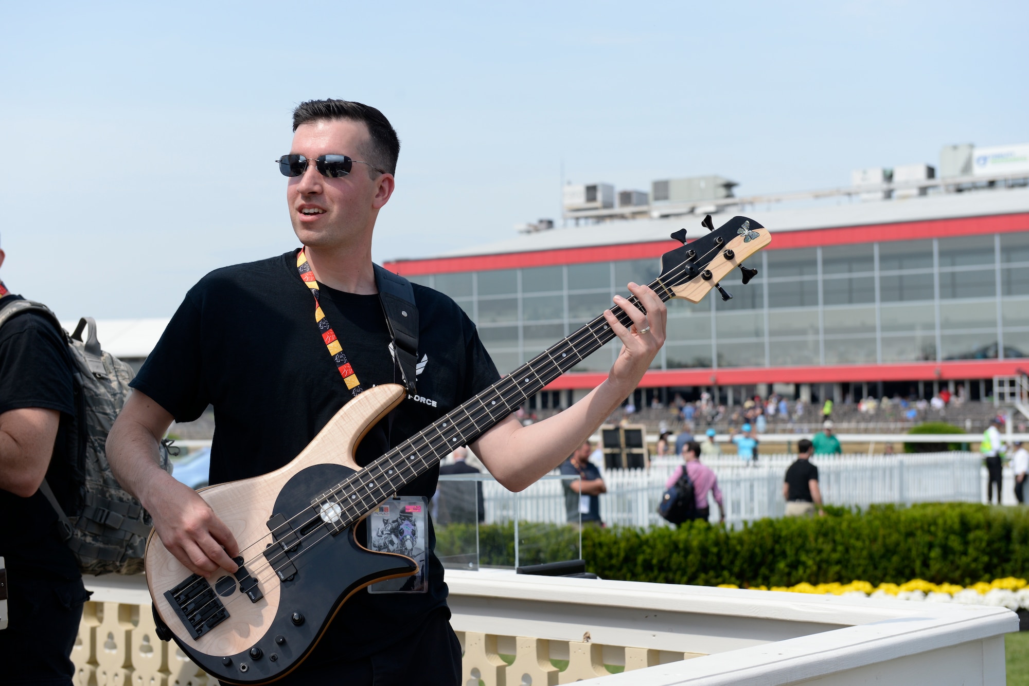Staff Sgt. Jordan Kimble, a bassist for the Heritage of America Band, performs a sound check before the 2015 Preakness Stakes May 16, at the Pimlico race course in Baltimore, Maryland. (U.S. Air Force photo by Tech. Sgt. Steve Stanley/Released)
