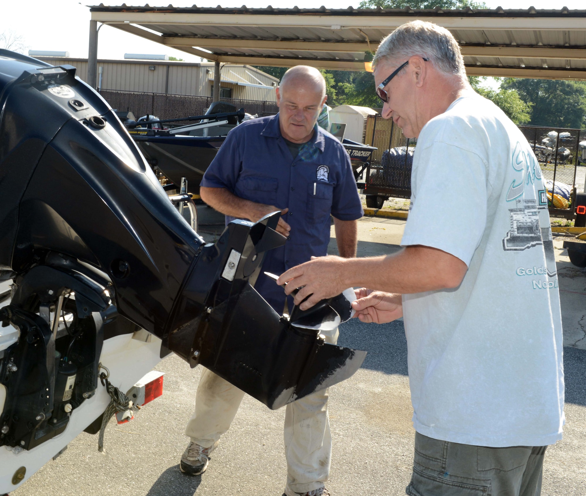 Paul Barry, a local retiree, returns a speedboat to Outdoor Recreation, May 4, 2015, as Dave Adams, a 78th Force Support Squadron outdoor recreation center employee, inspects it. Boats are available for rental for up to one week, and can be reserved up to 20 days in advance. (U.S. Air Force photo by Tommie Horton)