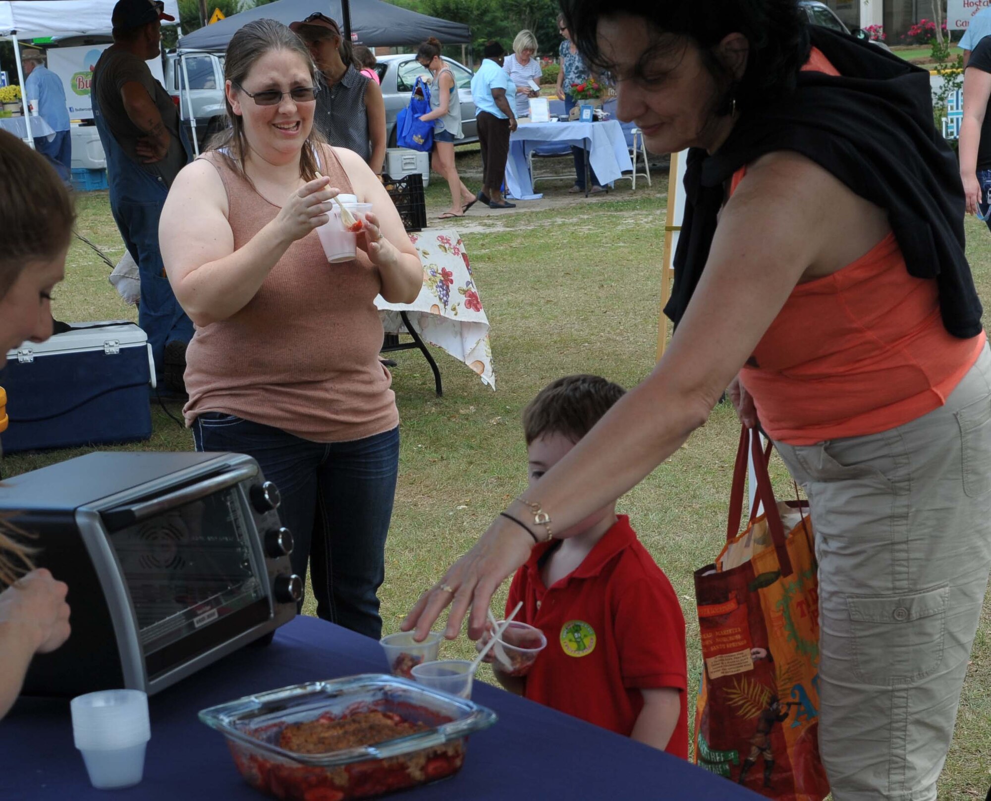 Parents and children enjoy Mom’s Day Out, a Day at the Market May 14. (U.S. Air Force photo by Ray Crayton)