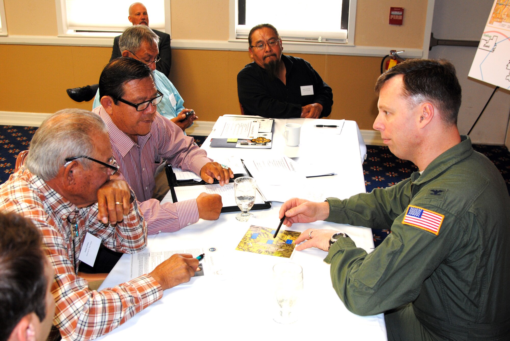 Col. Dagvin Anderson (right), 58th Special Operations Wing commander, listens to the concerns about low-flying aircraft from Governors E. Paul Torres (near left) from Isleta Pueblo, and Zia Pueblo Governor Isaac Pino (middle left), as Leguna Pueblo Governor Virgil Siow and Santo Domingo's Joey Aguilar listen in. (Photo by Jim Fisher) 
