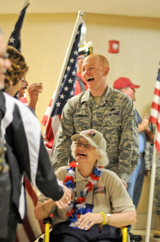 U.S. Air Force Airmen from the New Jersey Air National Guard’s 177th Civil Engineering Squadron came together with fellow military service members and people from the community to line the halls of Clearwater International Airport, Fla. to welcome home veterans of World War II on May 19, 2015. The honor flight was returning from a trip to Washington D.C. to visit war memorials.  (U.S. Air National Guard photo by Airman 1st Class Amber Powell/Released)